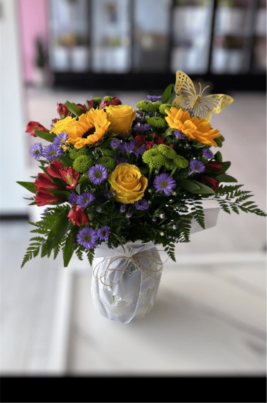 European Garden Bouquet for Spring - The essence of Europe comes to life in all its grandeur with this bright assortment of alstroemeria, button poms, Monte casino, sunflowers in an elegant clear rose vase. Elevate every moment with our fresh flower delivery service. Meticulously crafted by expert florists, each bouquet arrives fresh and vibrant. Whether for a birthday, anniversary, or a simple gesture, we bring beauty straight to your door. Order today and experience seamless delivery with unmatched elegance and freshness.