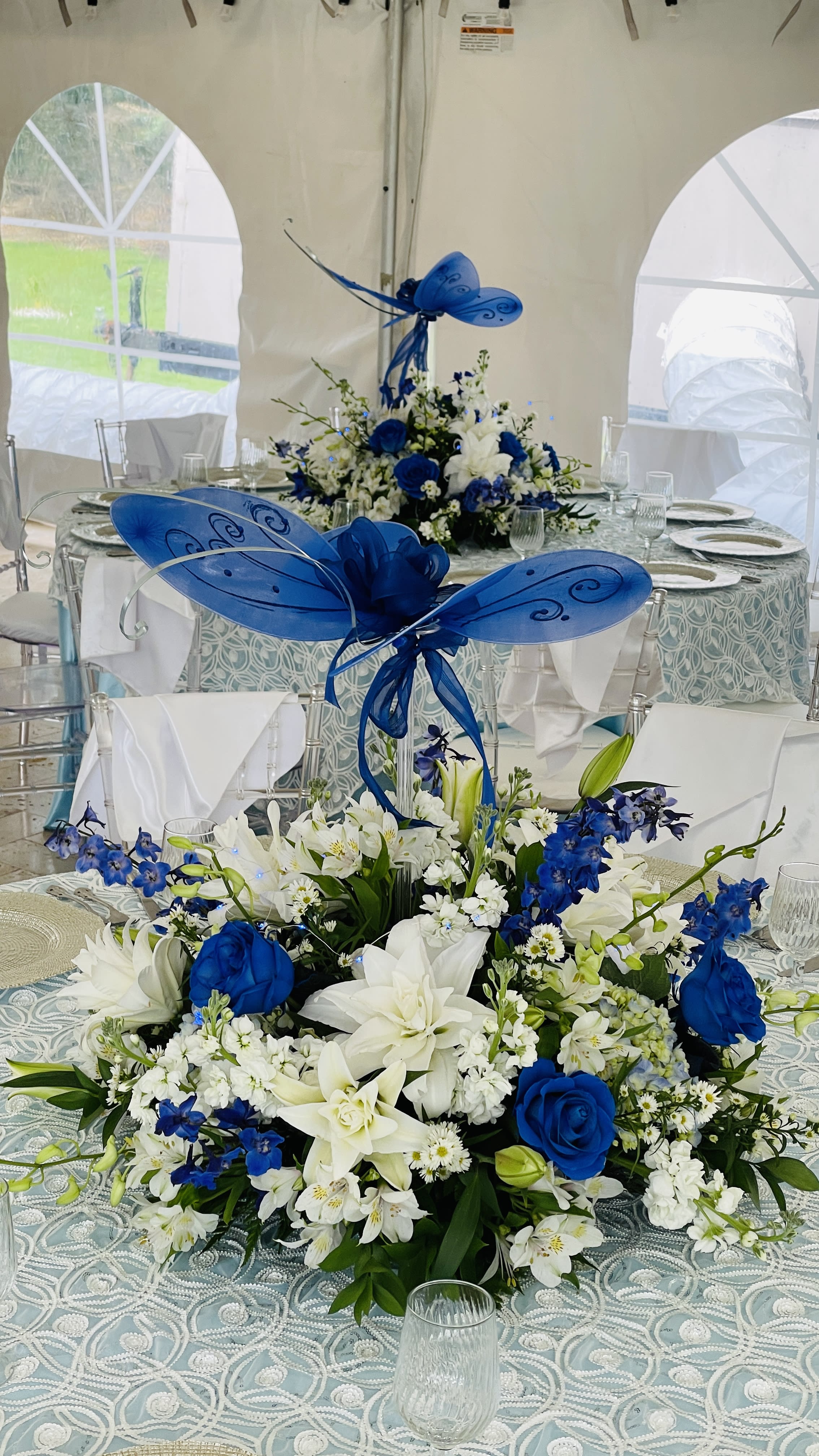 Centerpiece | Butterfly - Having an Event? In need of Floral Centerpieces, we can create beautiful floral centerpieces for any theme based on your budget and color palette. Contact us today so we can start planning and creating your event today. Displayed -A beautiful Butterfly Centerpiece for a homegoing reception. 