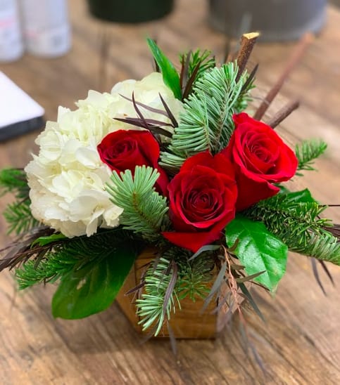 Merry Little Christmas Merry Little Christmas - Get into the holiday spirit with this gorgeous arrangement of reds and whites with a mixture of holiday greens!