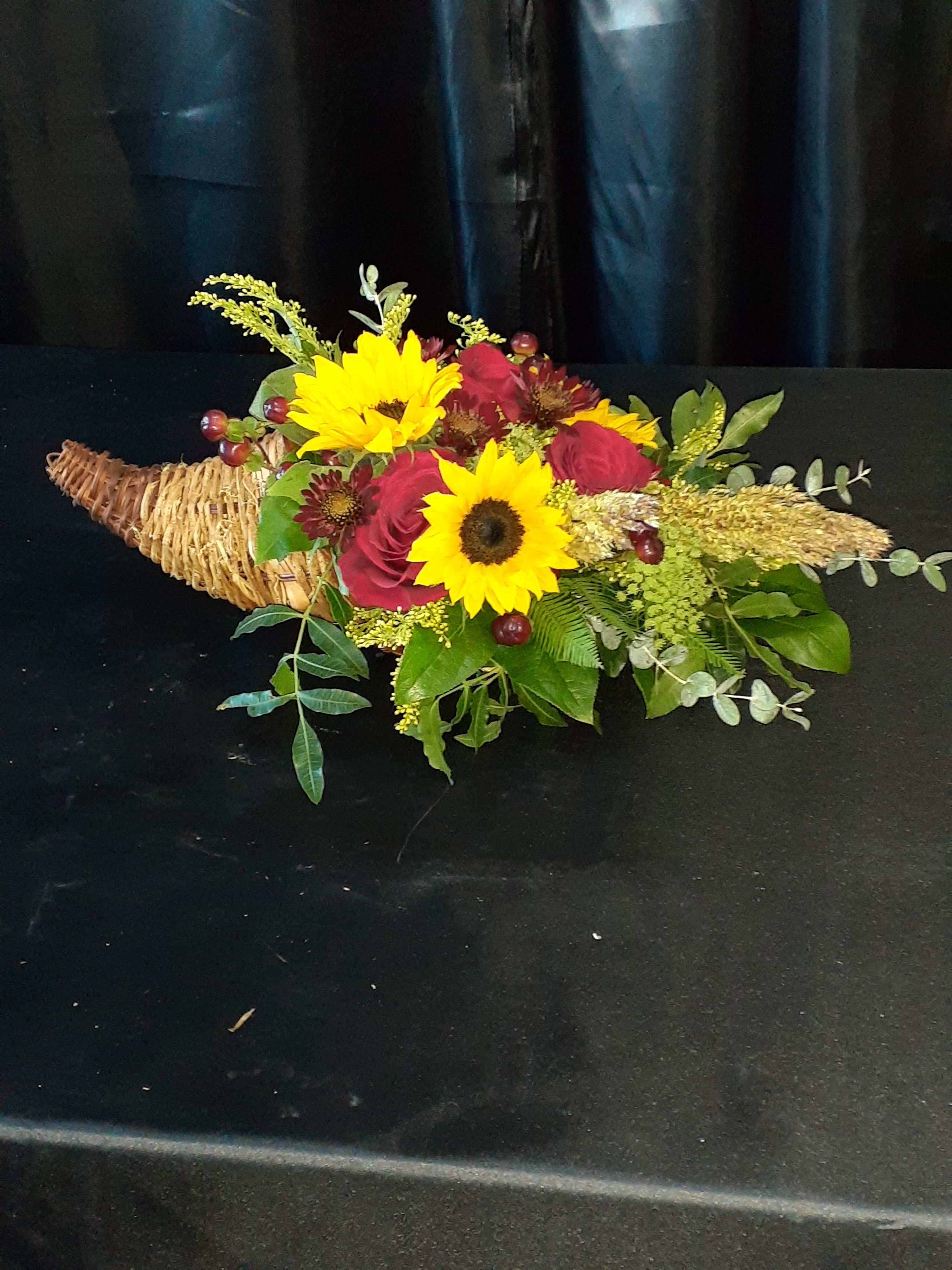 Thanksgiving Cornucopia Thanksgiving Cornucopia - A beautiful Cornucopia with fall flowers perfect for a centerpiece for the holidays