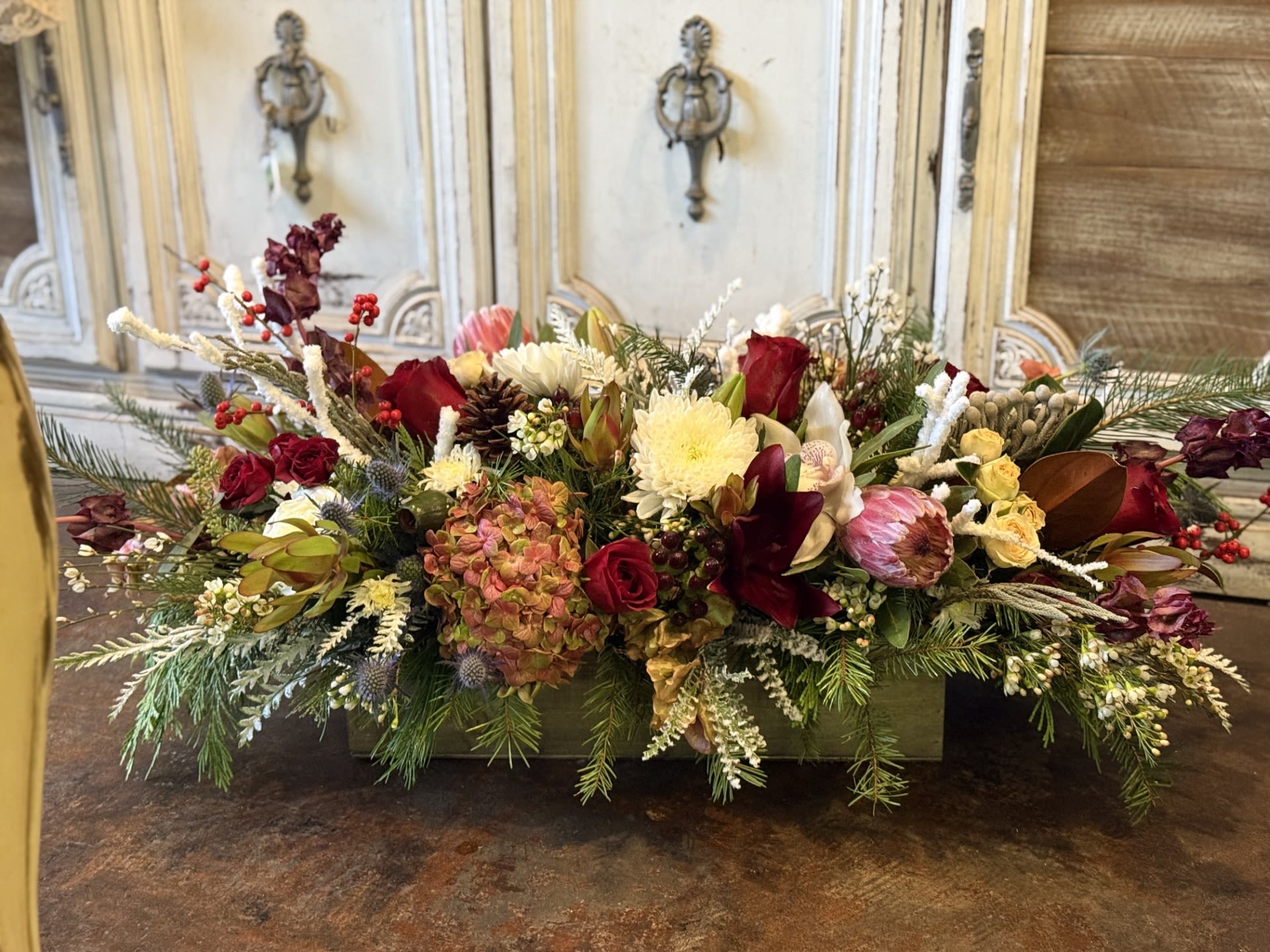 Tropical Christmas  Tropical Christmas  - Send this beautiful fresh flower mixture of Christmas greens, red roses, safari sunset and tropical mix and more! Table Top Christmas Decor, house warming gift floral arrangement!