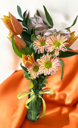 Sunset Bloom by Shelly's Floral - Warm-Tone arrangement featuring radiant orange with green blooms that brings warmth, and joy.