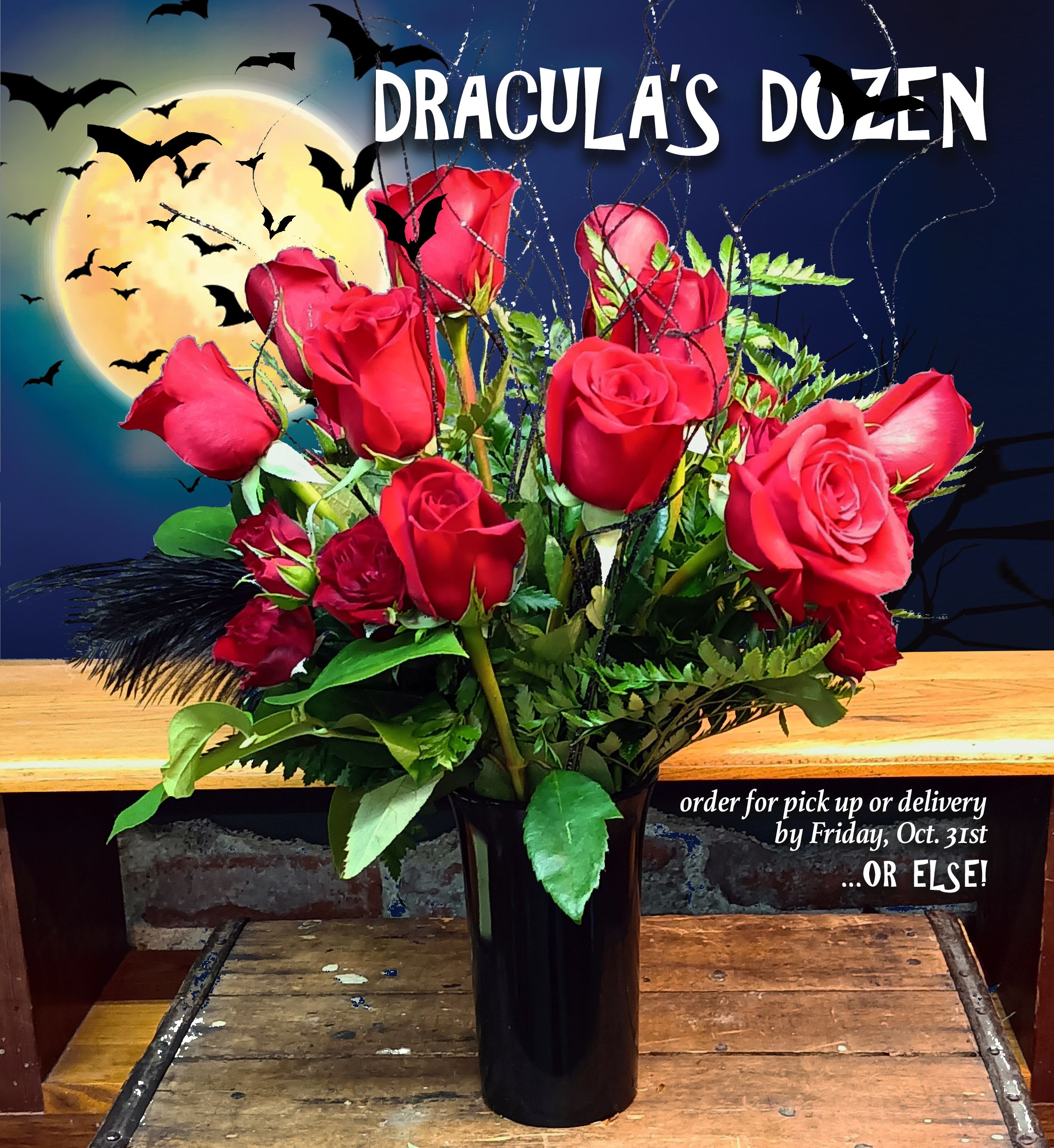 Dracula's Dozen - Beautiful Red Roses with Black Feather and Halloween Accents. We can spray the tips of the roses Black if requested.