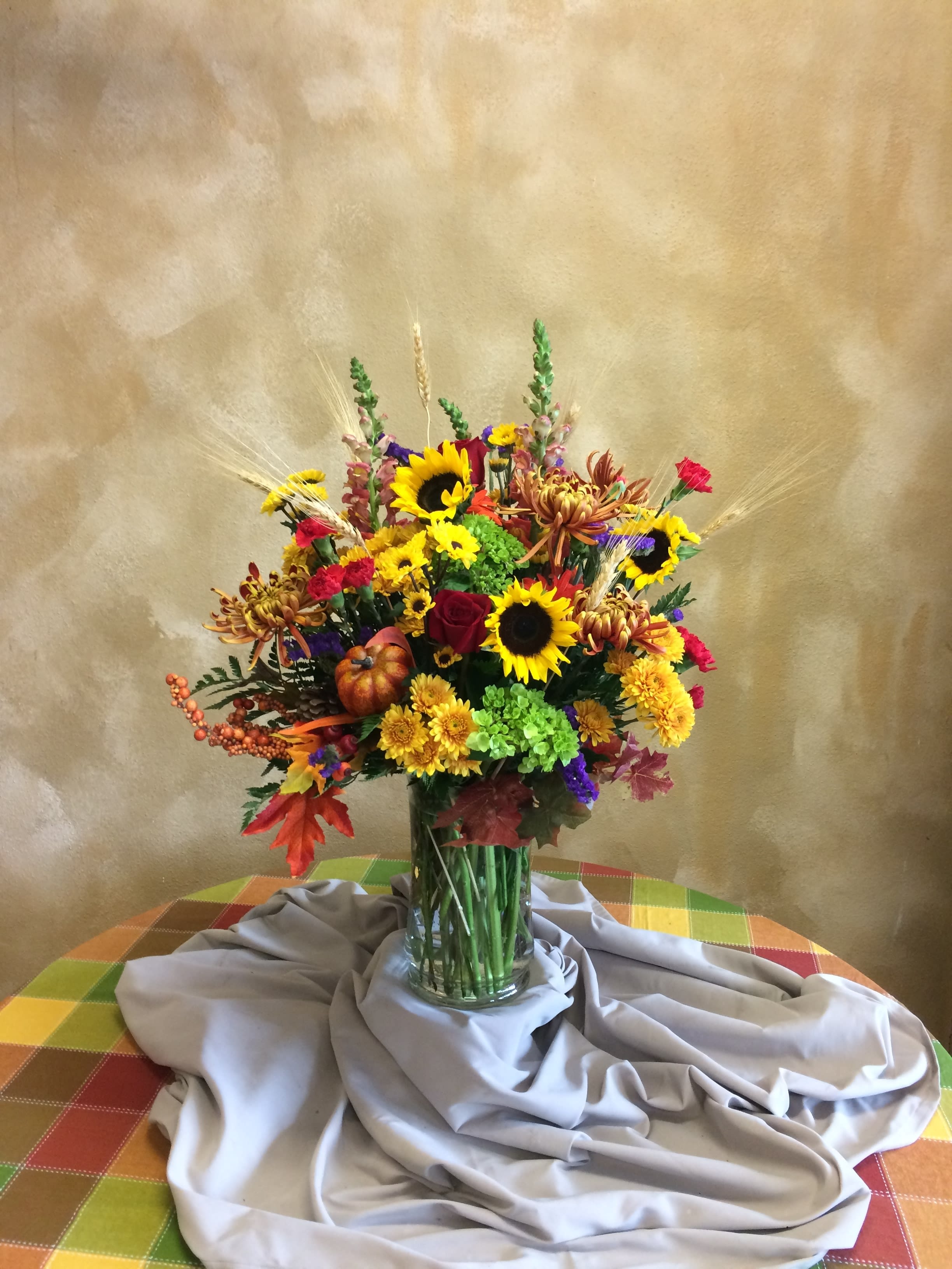 Spectacular Fall Bouquet - Wow someone special with this beautifully designed vase arrangement of the fall colors. All the colors of fall designed in an elegant vase arrangement. Approx 30&quot; tall by 18&quot; wide