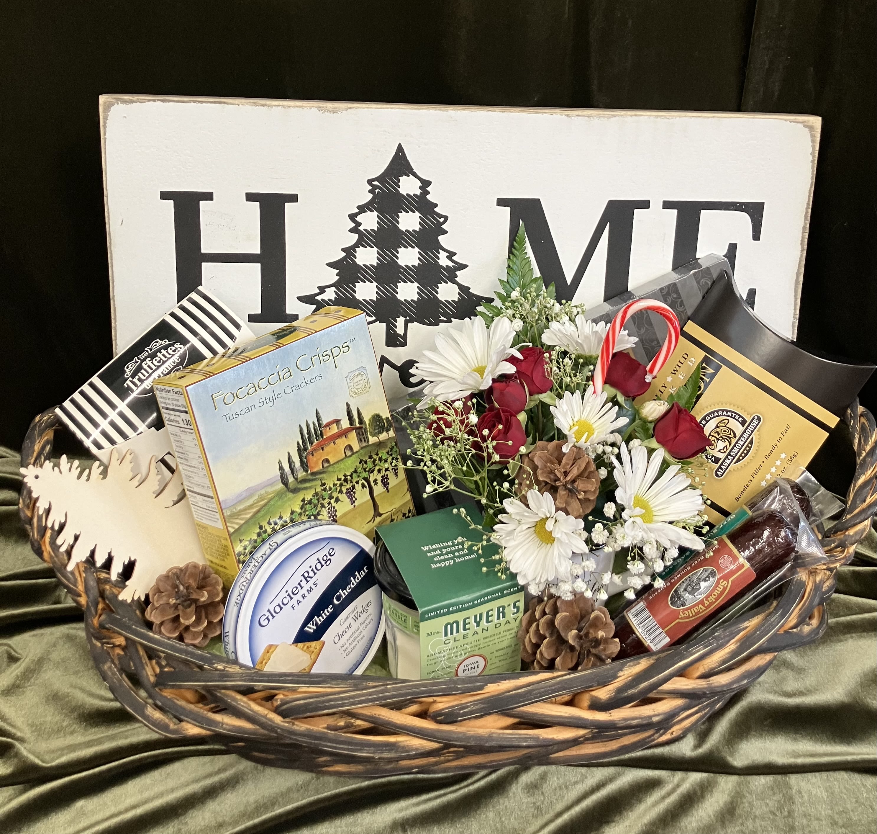 Home Sweet Home Gourmet Basket  - Beautiful gift basket specially curated for the upcoming winter season featuring a wooden sign made in America, yummy treats like summer sausage, crackers, cheese, truffles,  delicious chocolate salted caramels and a fresh flower arrangement in a cute winter mug! 