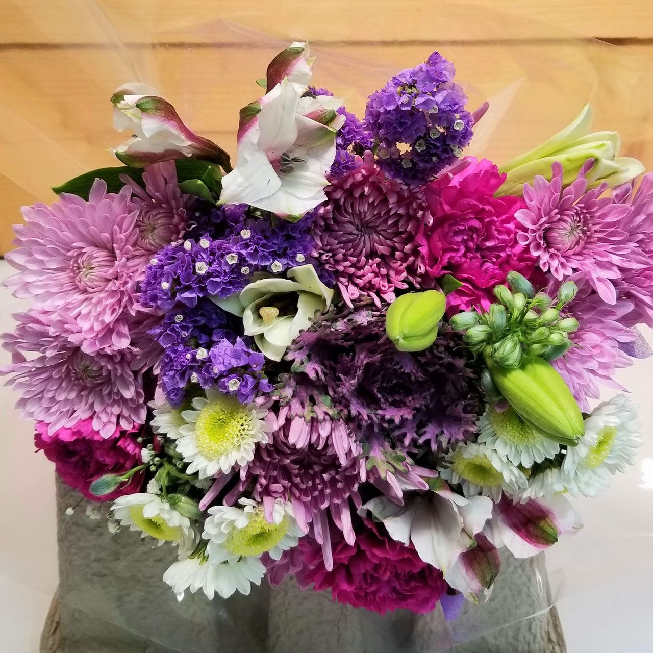 Wrapped Purple Bouquet - The Wrapped Purple Bouquet by Savilles Country Florist.  Wrapped bouquet of fresh cut flowers in Purple colors.