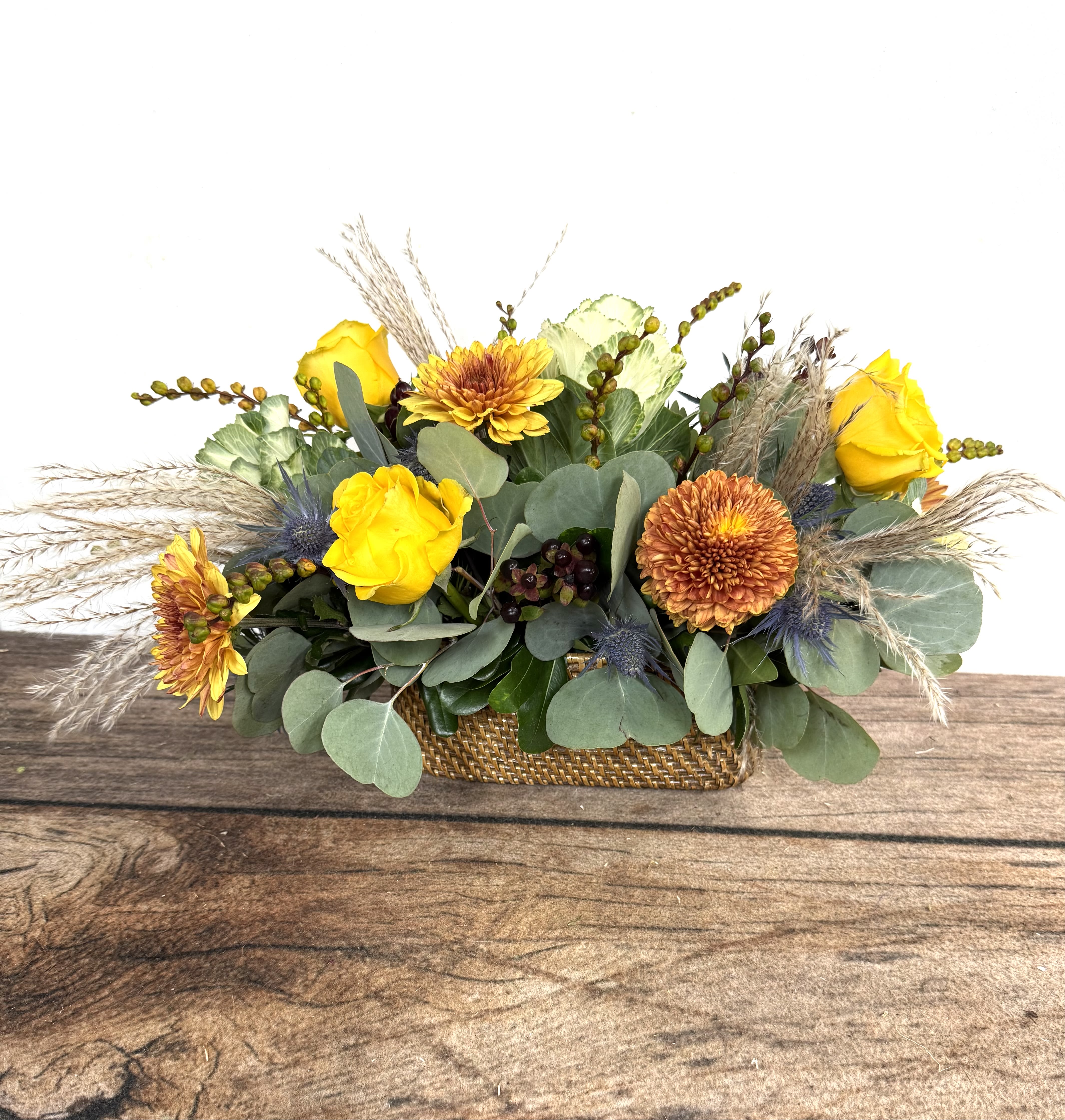 Urban Chic - An earthy arrangement with dried accents in a contemporary, woven container.   Approx. 18&quot; long x 10&quot;h