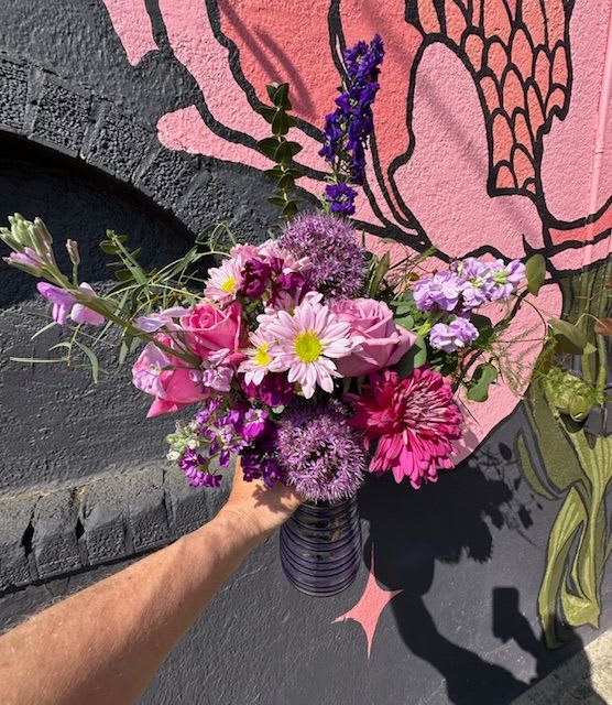 Hugs of Hues Arrangement - Send a gentle embrace with our Hugs of Hues Arrangement, a soothing blend of soft pastel pinks, purples, and lavender-toned blooms. Thoughtfully designed by our expert floral team at The Flower Cart, this arrangement is a tender expression of affection—perfect for lifting spirits, celebrating love, or simply brightening someone’s day.  Delicate blushes, lavender-toned, and pastel blooms create a dreamy, soothing palette, while deeper purple blooms and bright pinks add a touch of richness and depth. Accented with fresh greenery, this hand-arranged design brings comfort, elegance, and heart to any occasion. This bouquet is a perfect expression of affection, making it ideal for moments when you want to send a loving hug or brighten someone’s day with a burst of pastel beauty.  As a family-owned Baltimore Florist proudly serving our community since 1961, we specialize in handcrafted arrangements that speak volumes. We offer fast, same-day flower delivery in Baltimore, including Baltimore City, Baltimore County, and nearby areas.  Let The Flower Cart help you share love and light with beautiful, locally designed flowers—delivered with care and heart. 