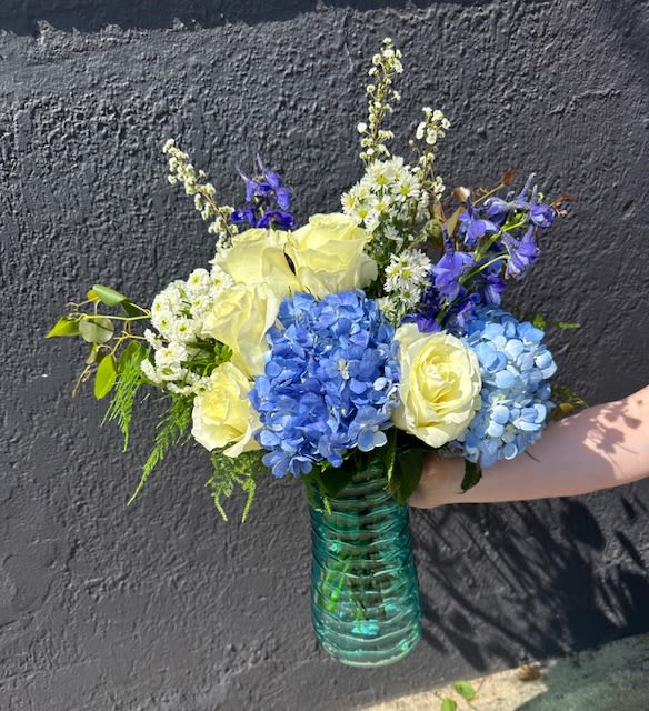 Moonlight Arrangement - Bring the calming beauty of a moonlit evening indoors with our Moonlight Arrangement, a serene and sophisticated floral arrangement crafted by The Flower Cart—your trusted Baltimore Florist since 1961. Featuring a graceful blend of creamy whites and soft blues this arrangement captures the quiet elegance of moonlight reflecting on still waters.  Hand-arranged with fresh greenery to add natural depth and texture, the Moonlight Arrangement exudes tranquility and timeless beauty. Ideal for expressing sympathy, celebrating life’s peaceful moments, or simply adding a touch of refined charm to any space.  We offer same-day flower delivery in Baltimore, including Baltimore City, Baltimore County, and surrounding areas.   Whether you're sending a thoughtful gesture or decorating with elegance, let The Flower Cart illuminate your moment with flowers designed from the heart.  