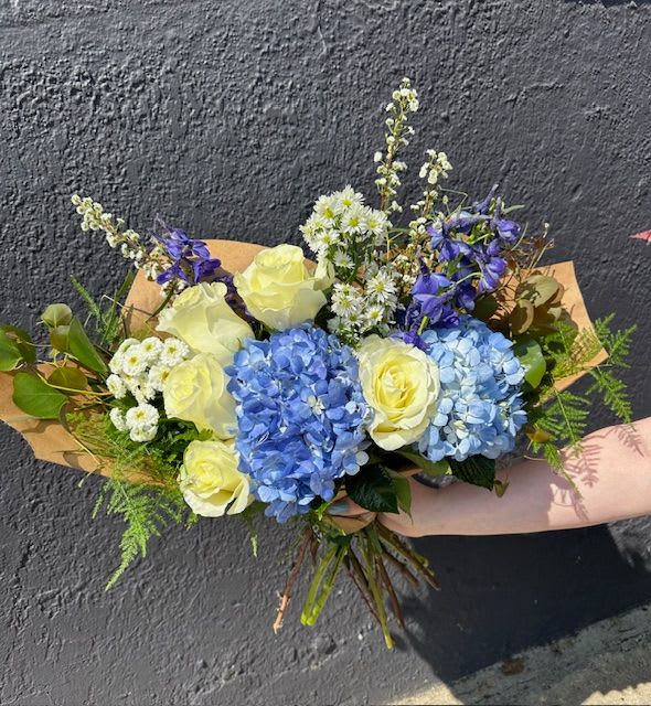 Moonlight Bouquet - Bring the calming beauty of a moonlit evening indoors with our Moonlight Bouquet, a serene and sophisticated floral bouquet crafted by The Flower Cart—your trusted Baltimore Florist since 1961. Featuring a graceful blend of creamy whites and soft blues, this bouquet captures the quiet elegance of moonlight reflecting on still waters.  Hand-arranged with fresh greenery to add natural depth and texture, the Moonlight Bouquet exudes tranquility and timeless beauty. Ideal for expressing sympathy, celebrating life’s peaceful moments, or simply adding a touch of refined charm to any space.  We offer same-day flower delivery in Baltimore, including Baltimore City, Baltimore County, and surrounding areas.  Whether you're sending a thoughtful gesture or decorating with elegance, let The Flower Cart illuminate your moment with flowers designed from the heart.