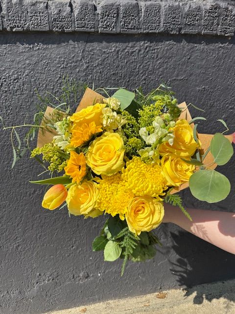 Ray of Sunshine Bouquet - Looking to brighten someone’s day? Our Ray of Sunshine Bouquet is the perfect choice. This cheerful bouquet features a vibrant mix of yellow blooms, expertly hand-arranged to radiate warmth, joy, and positivity. Whether you're celebrating a birthday, sending get well wishes, or delivering a &quot;just because&quot; surprise, this bouquet is sure to lift spirits.  Each bouquet is crafted with care by our skilled floral designers using the freshest seasonal flowers—many sourced from Maryland flower farms. We offer fast, reliable flower delivery in Baltimore, including same-day service throughout Baltimore City and surrounding counties.  Proudly serving the community since 1961, The Flower Cart is your local Baltimore florist, known for quality, creativity, and heartfelt service. Let us help you connect, comfort, and celebrate with flowers made to make moments brighter.