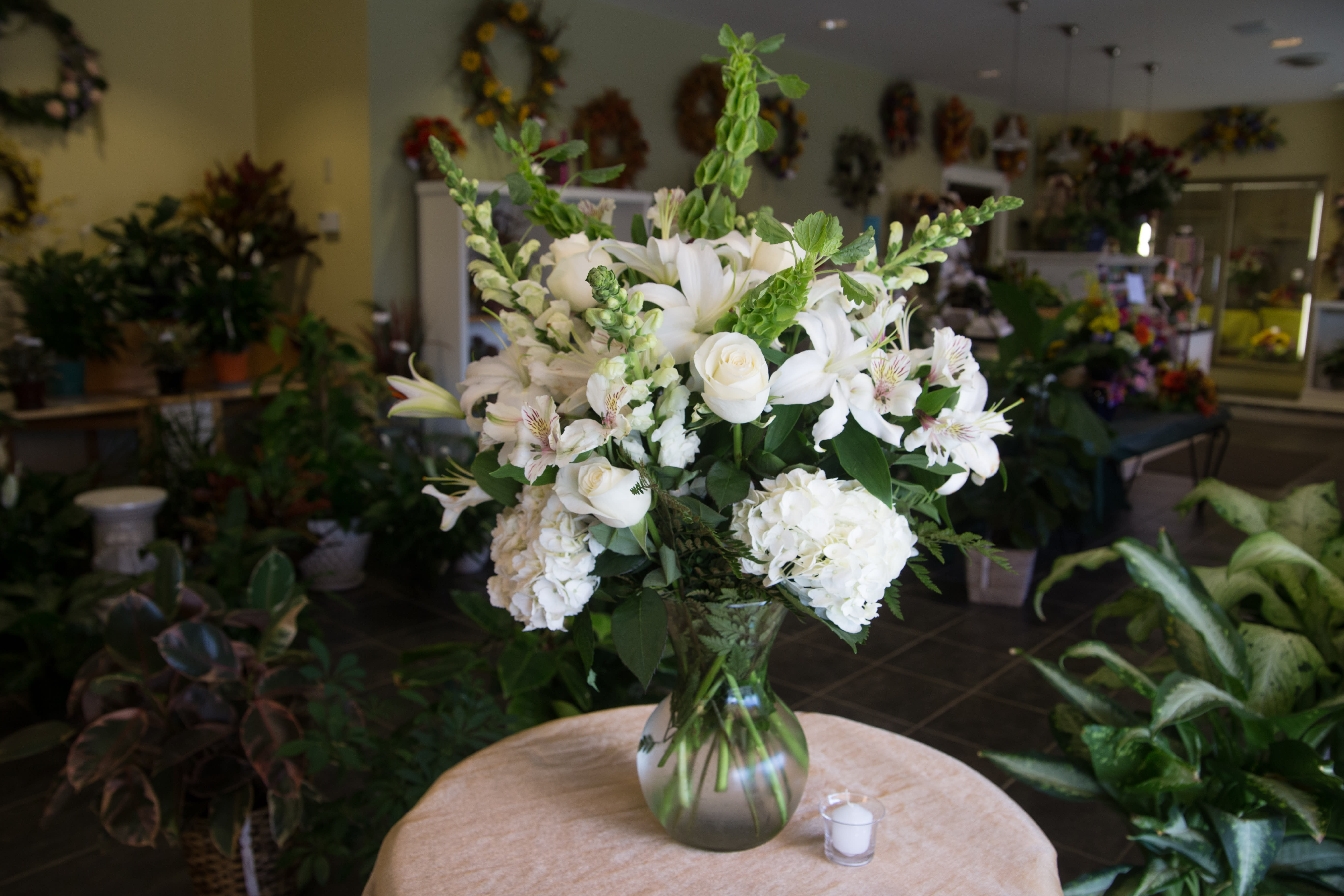 Simple Beauty - A gorgeous mix of all white flowers in a clear glass vase