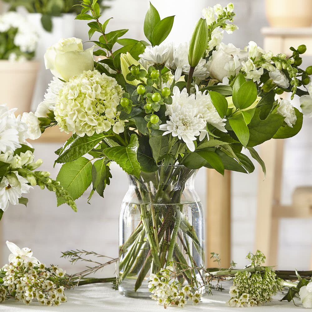 Classic Ivory Flower Bouquet (Ultra Premium) - Elevate any occasion with the timeless elegance of the Classic Ivory Flower Bouquet. Expertly crafted and designed by our florist, this bespoke arrangement showcases the finest-quality blooms in soft, neutral tones.  While the exact design and floral varieties may vary due to freshness and availability, each bouquet is thoughtfully arranged to ensure a unique and stunning presentation. Perfect for celebrating life’s special moments or sending a heartfelt gesture, this bouquet is a true classic.  Order the Classic Ivory Flower Bouquet today and let our florists create a one-of-a-kind masterpiece tailored just for you.