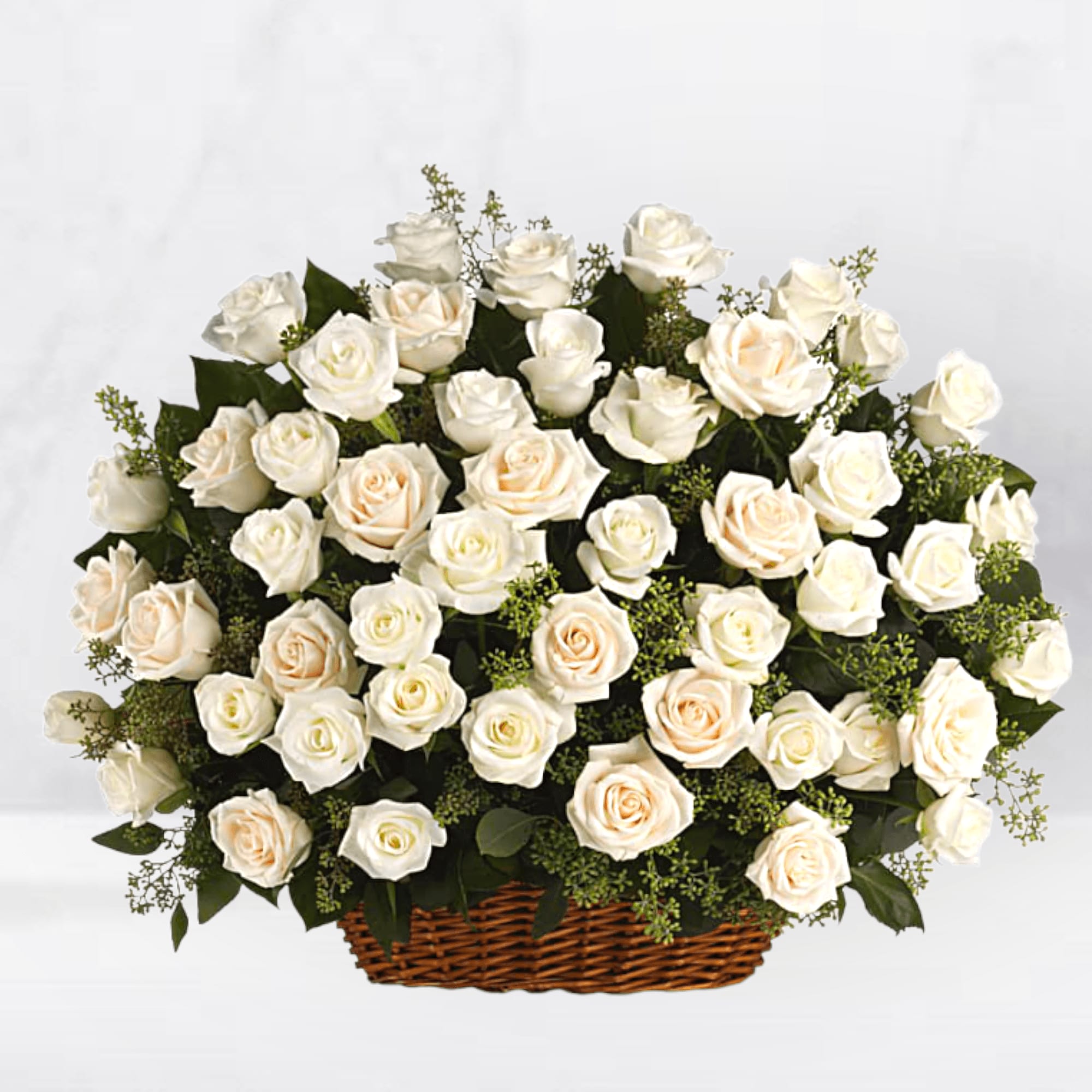 Beautiful Rose Flower Basket - The everlasting beauty of a traditional English garden is evoked with this bountiful beautiful rose flower basket of radiant white and crème roses. Fresh and peaceful, this lovely arrangement will console and uplift, at home or at the service.  White and crème roses, presented with fragrant seeded eucalyptus in a large, rectangular basket. Orientation: One-Sided