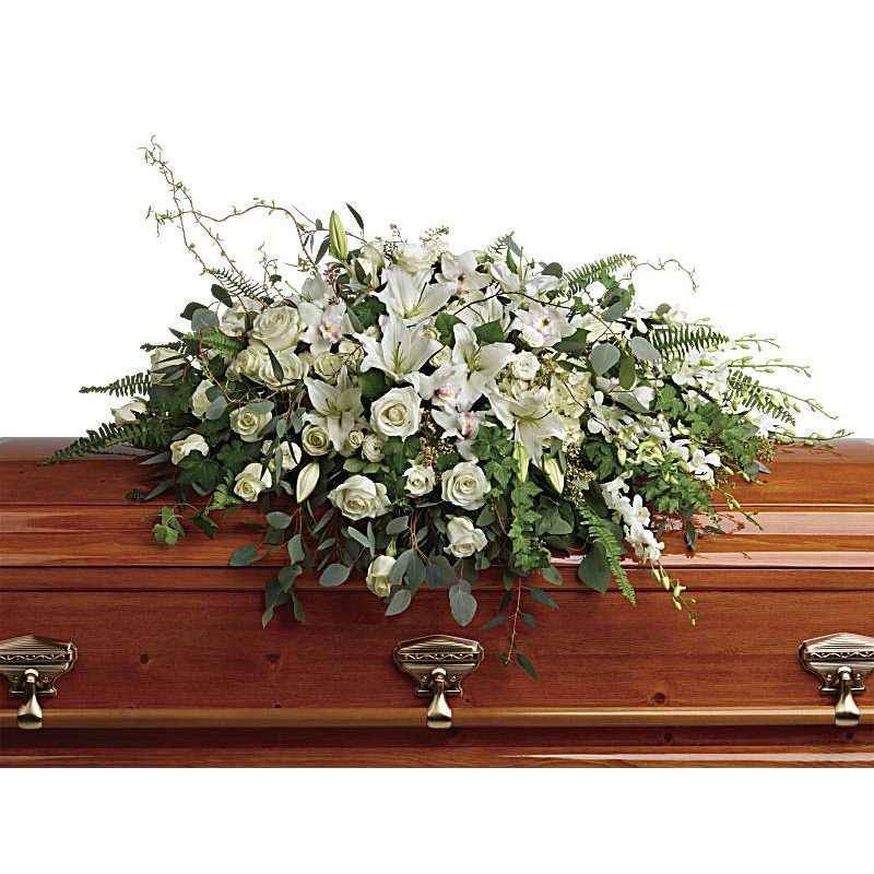 Grandest Glory Casket Spray - The Grandest Glory Casket Spray from DGM Flowers is a stunning tribute to a loved one. Peaceful and majestic, this grand spray of snow white hydrangea, orchids, roses and lilies is a hopeful tribute to a bright life and your unending love.  This stunning white casket spray flowers includes white hydrangea, white cymbidium orchids, white dendrobium orchids, white roses, white spray roses, white oriental lilies, curly willow, green ivy, parvifolia eucalyptus, seeded eucalyptus, silver dollar eucalyptus, sword fern, and lemon leaf.   33&quot; H X&nbsp;48 1/2&quot; W