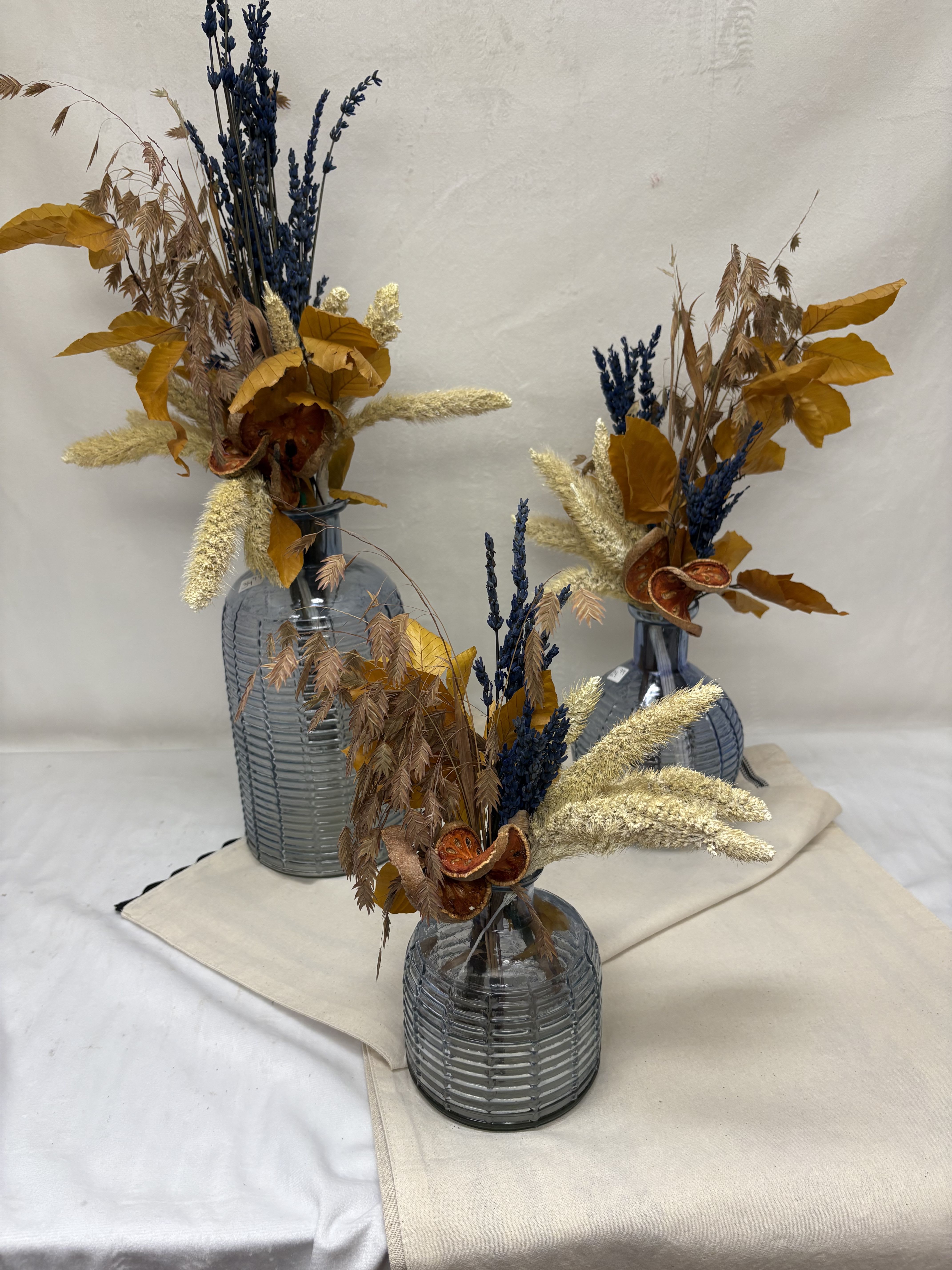 Autumn Sapphire - Summon the magic of autumn with a set of 3 glass vases infused with seasonal dried flowers