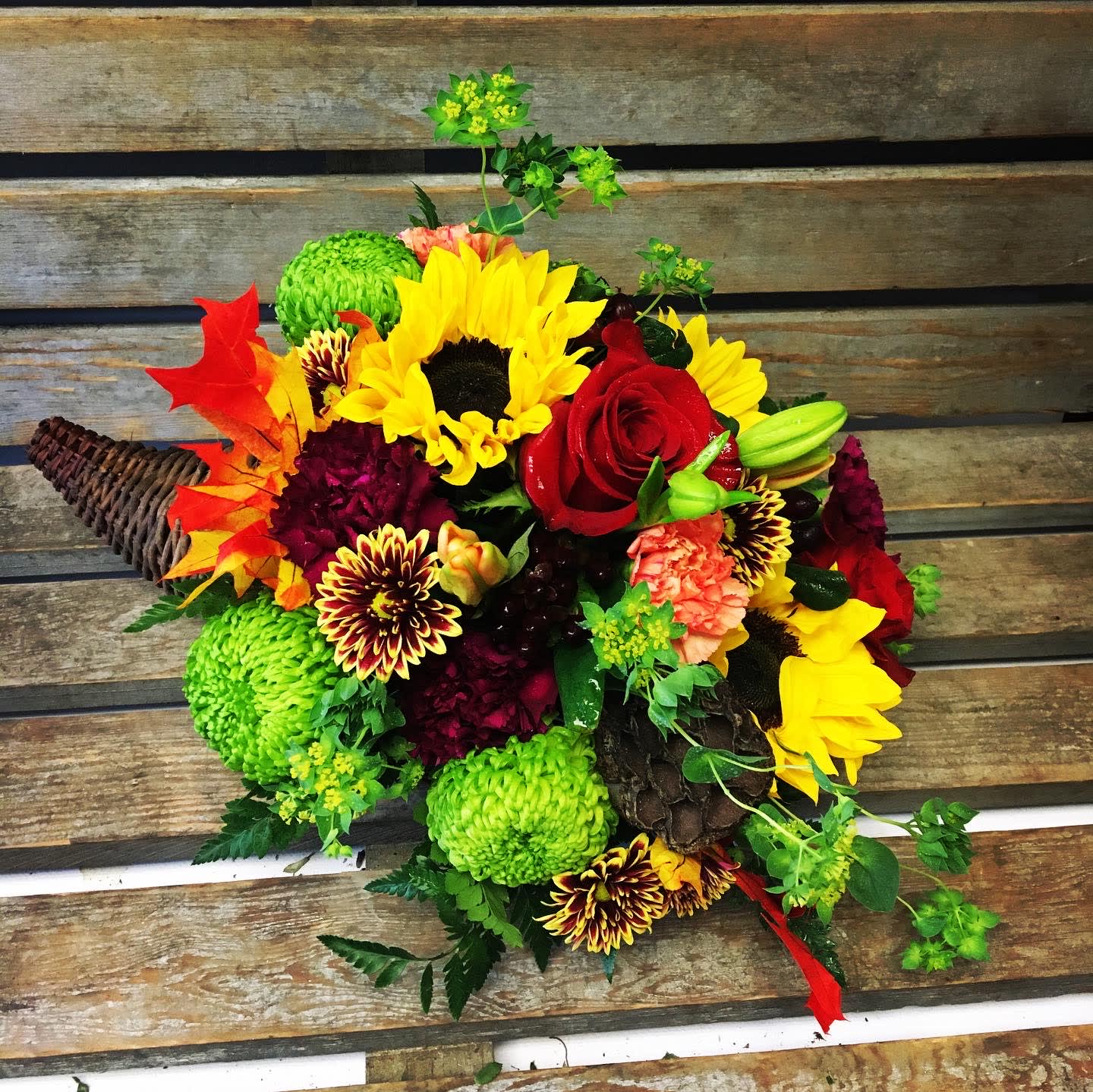 Giving Thanks Cornucopia  - Fall flowers in a thanksgiving cornucopia  Fall flowers seasonal mix 