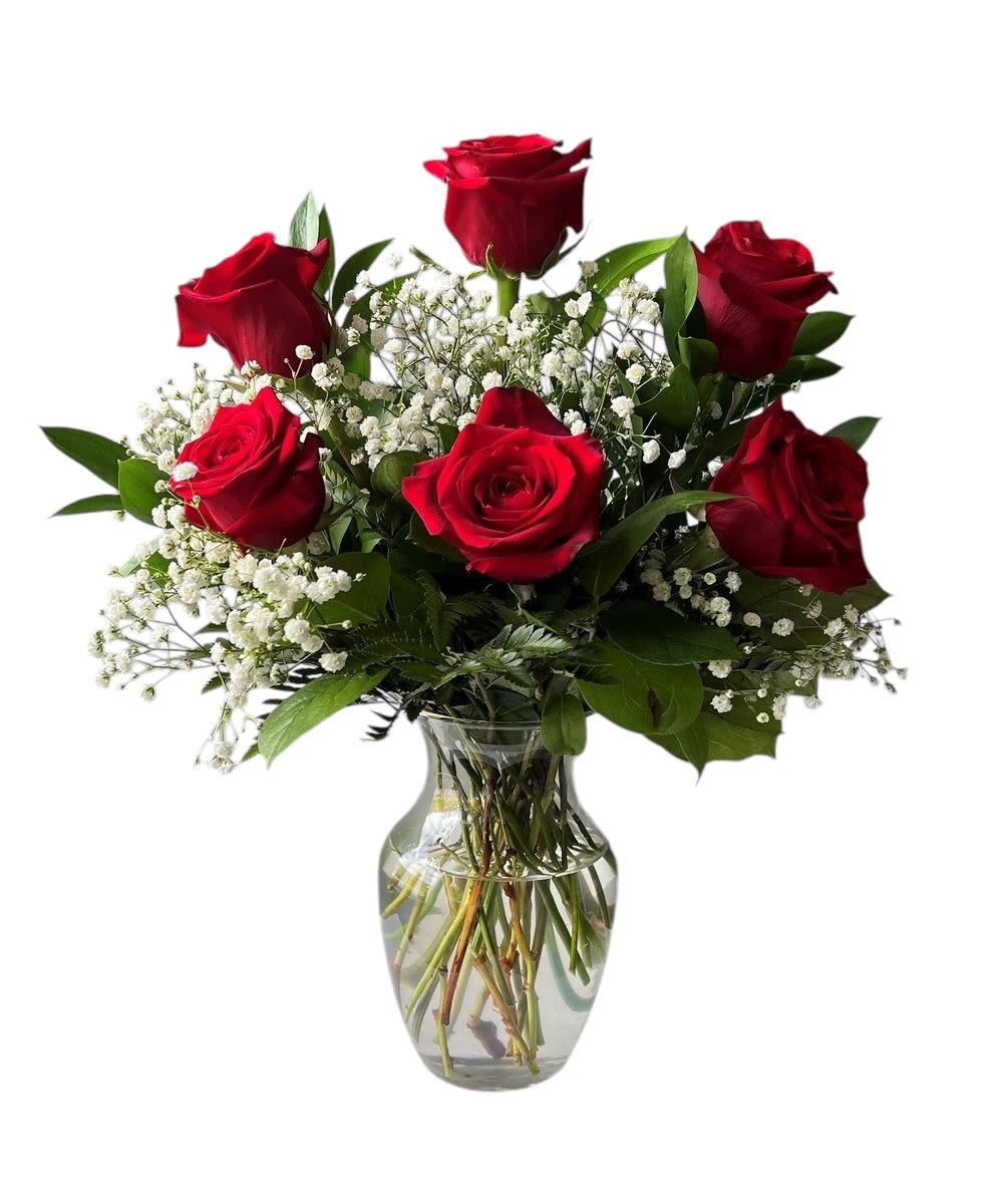 Six Red Roses - Six vibrant and fresh handpicked roses with a verdant appeal in a clear glass vase. The simplicity of the design makes it perfect for a modern display, but its sheer beauty could also shine in a traditional setting.