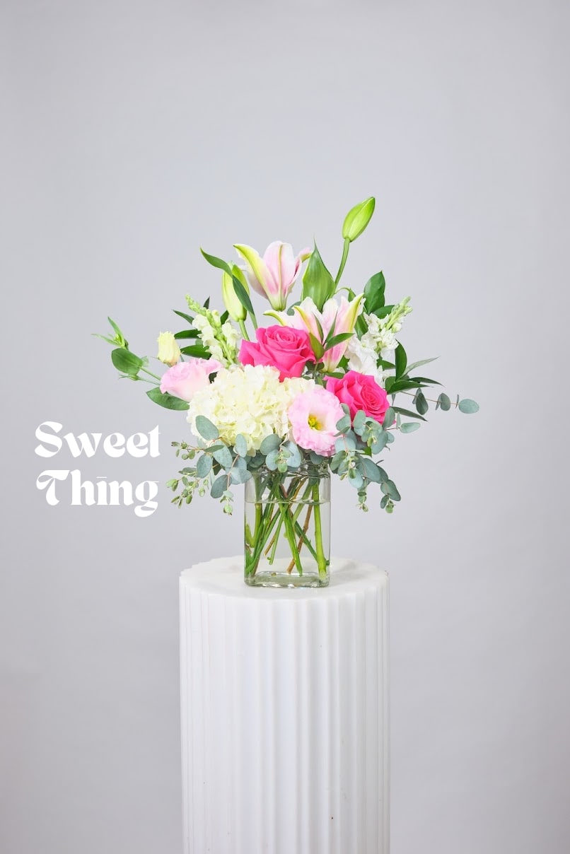 Sweet Thing Sweet Thing - Soft pinks and whites come together in this charming arrangement full of sweetness and cheer. A perfect pick me up or thoughtful gift. *While we can’t always promise every single flower will be in stock, we’ll always keep the same style, color palette, and feel. Different blooms, same energy.*