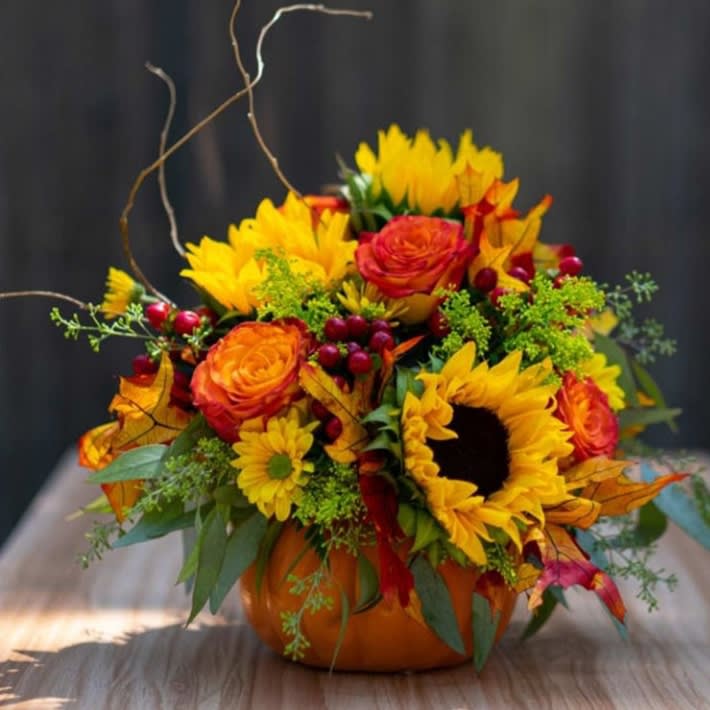 Fall Flowers Arrangements - Mixture of fall flowers in actual pumpkin, perfect for fall Autumn gift