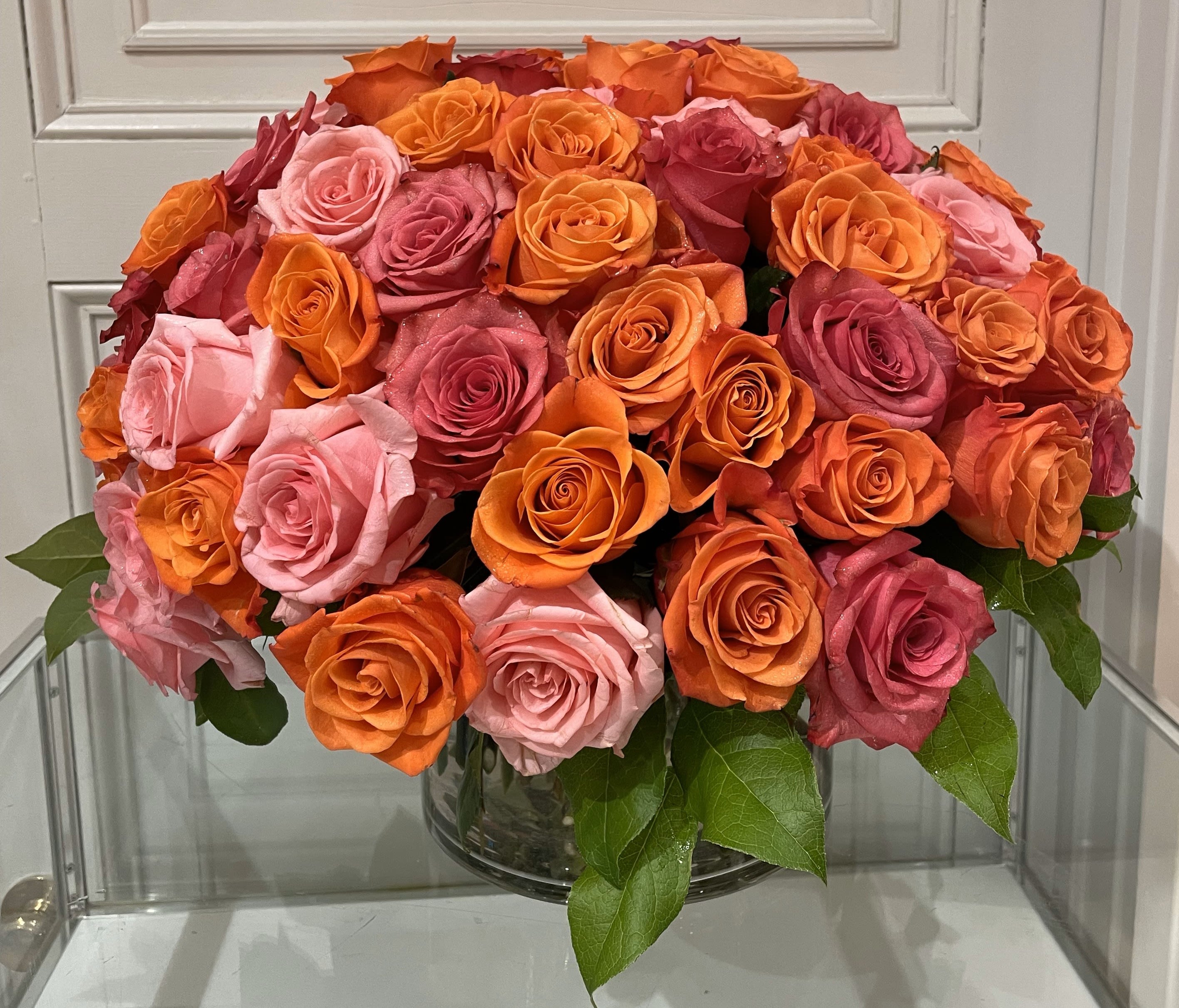&quot;Roses En Masse&quot; Bouquet, Pink and Orange - Mixed roses in pink and orange tones arranged en masse makes for quite a display.  This assortment contains 60 individual roses, truly stunning.  With some advance notice, we can create any color combination you desire.
