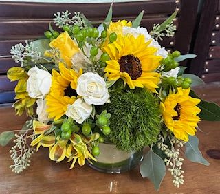 your my sun shine - a cylinder vase filled with sunflowers, hydrangea and other seasonal flowers. just the thing to brighten your day