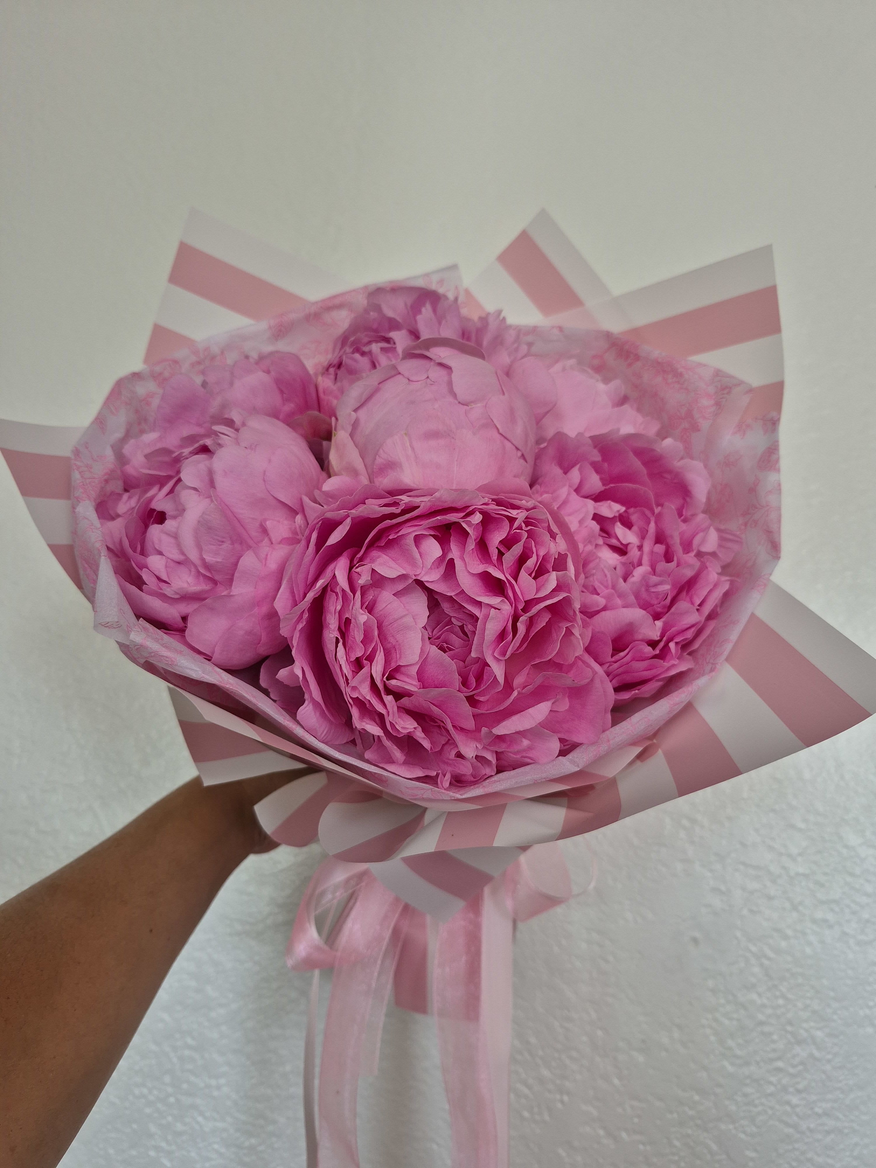 Pretty Peonies Handtied Bouquet  - Peonies are everyone's favorite. It's perfect for all occasions, and the stunning blooms and unique scent makes it everyone's favorite in San Diego.  Standard -10 Peonies  Deluxe - 15 Peonies Premium - 25 Peonies  