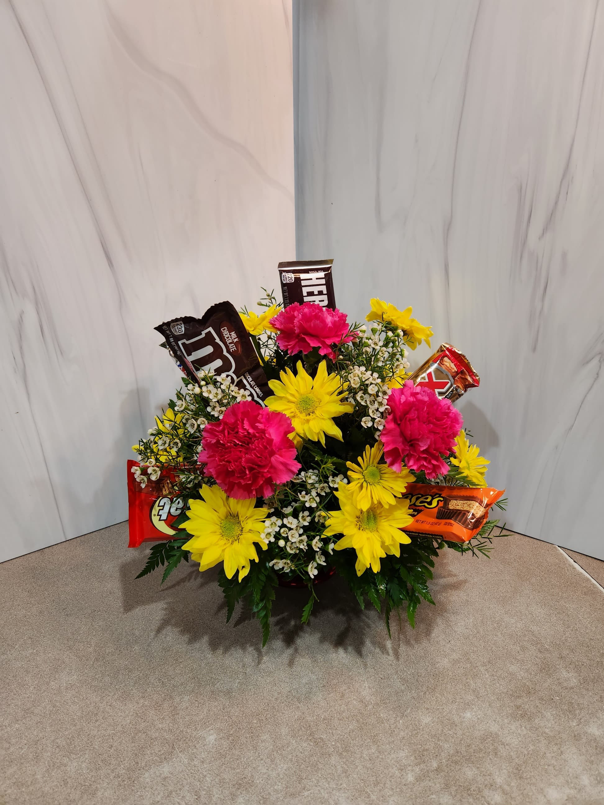 Candy Bar arrangement - Capture their sweet tooth and love of flowers in one arrangement.  Deluxe and Premium have additional candybars.