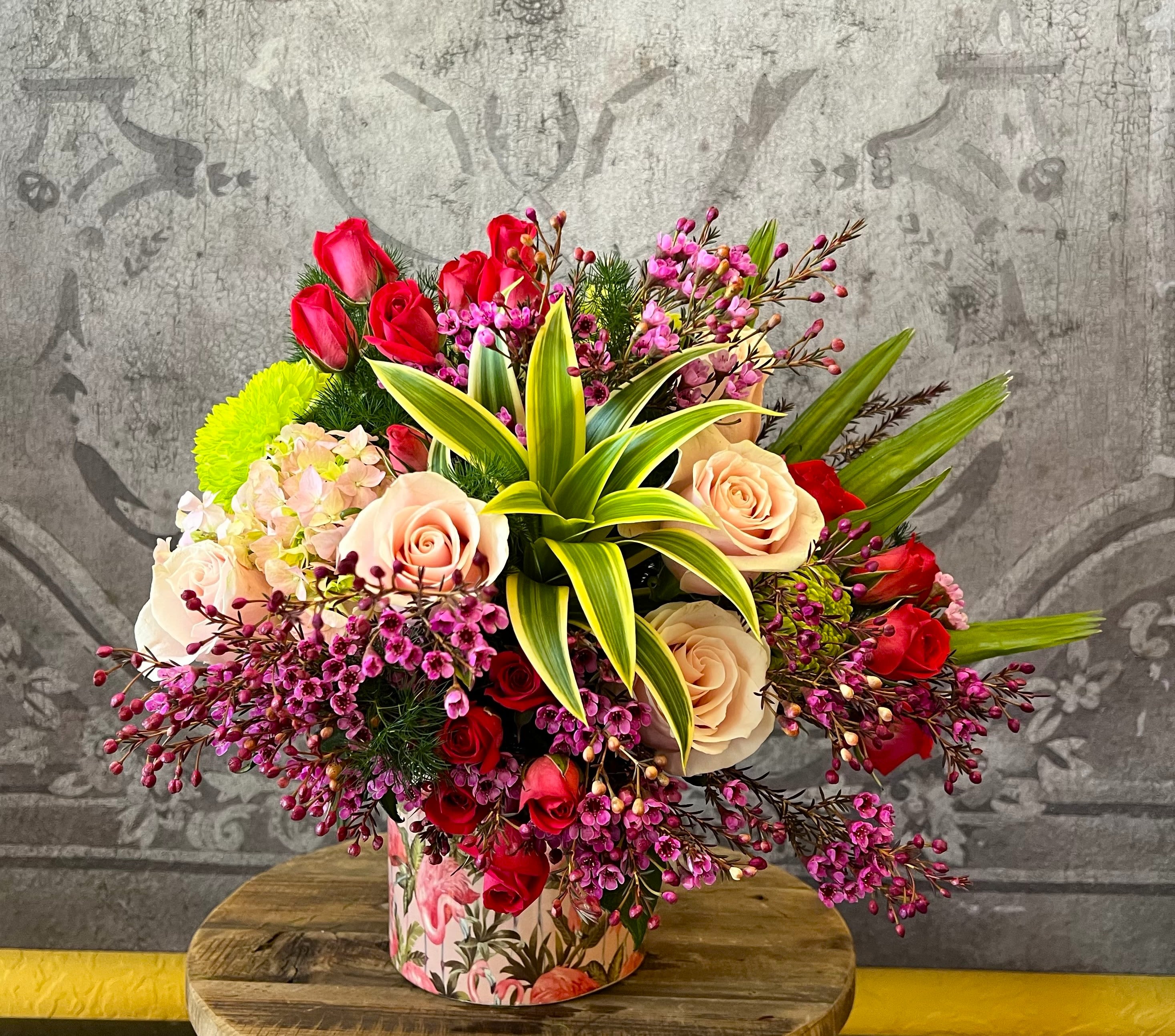 The Perfectly Pink Flamingo - This beautiful arrangement in shades of Blush, Pink &amp; Green comes arranged in a charming flamingo vase.