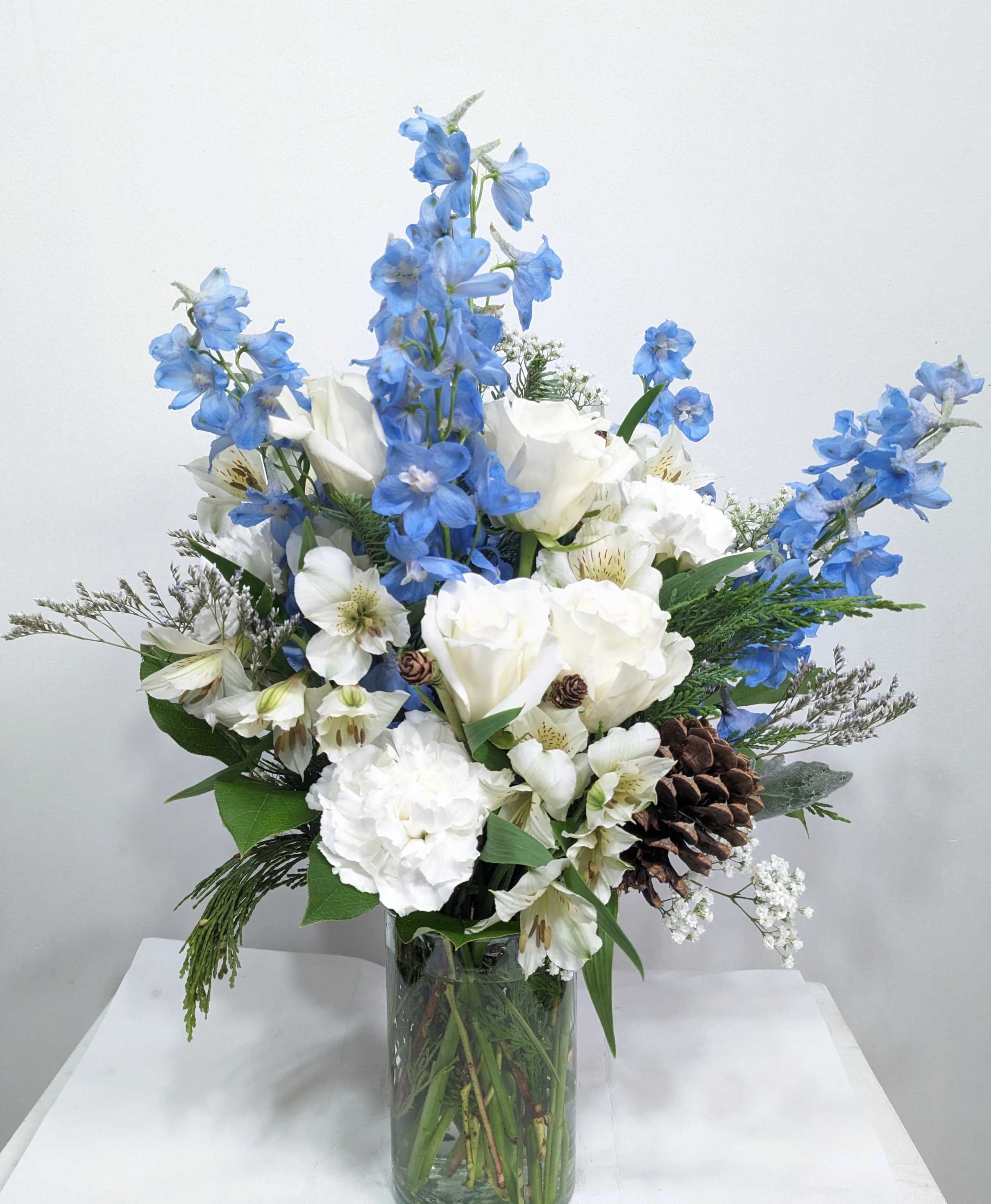 Orion's Belt  - A blue and white arrangement featuring roses, alstroemeria, and Hydrangea. Send this arrangement to anybody who likes stargazing or the night sky. A perfect gift to send for Hanukkah or the winter season.  Approximate Dimensions: 15&quot;D x 20&quot;H