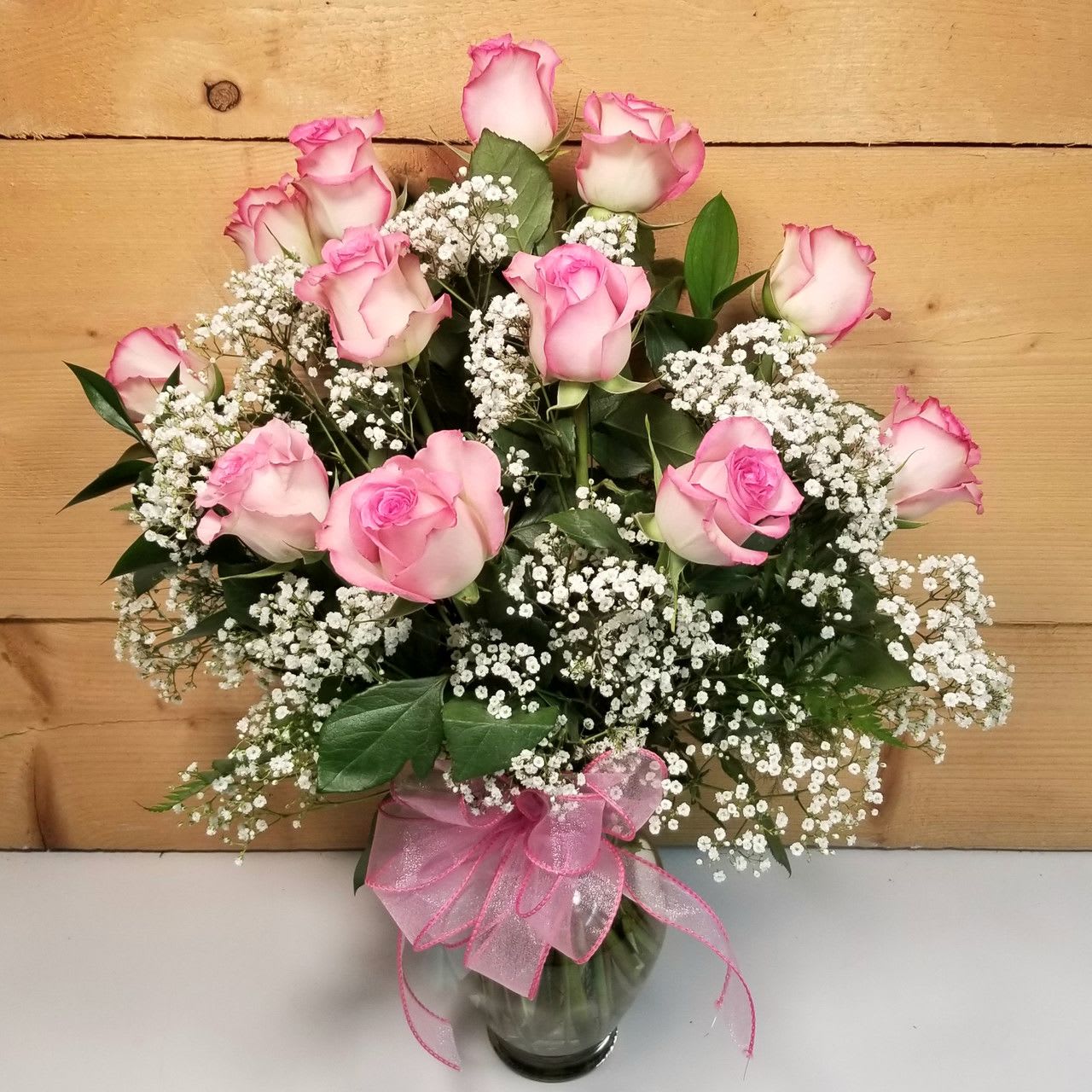Rose Elegance Pink - Long-stem pink roses are just the gift when you want to express yourself with all the grace, sophistication and elegance they deserve--and more. Give fresh romance and passion with this beautiful, hand-crafted arrangement of premium long-stem pink roses.    PLEASE NOTE: Some flowers, plants, vases and other products pictured are subject to availability, and may be substituted for a similar color / style item if unavailable according to our substitution policy.