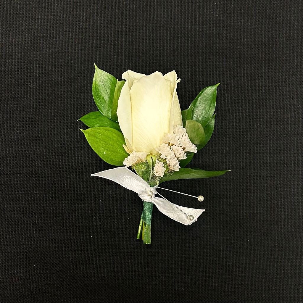 The Classic Boutonniere - Single Rose Boutonniere with Ruscus by Petals in Wilmington, Delaware   Add a touch of elegance to any special occasion with the Single Rose Boutonniere with Ruscus, handcrafted by Petals, your trusted local Wilmington, Delaware florist. Available in white, red, pink, yellow and orange. This classic boutonniere features a fresh, single rose accented with lush ruscus greenery, creating a refined and timeless look that complements weddings, proms, formal events, or special celebrations. Perfect for grooms, groomsmen, fathers of the bride or groom, or anyone attending a formal occasion, this boutonniere is carefully designed to provide a fresh, polished, and lasting floral accent. Each piece is handcrafted with care to ensure your flowers arrive beautiful and ready to wear.  