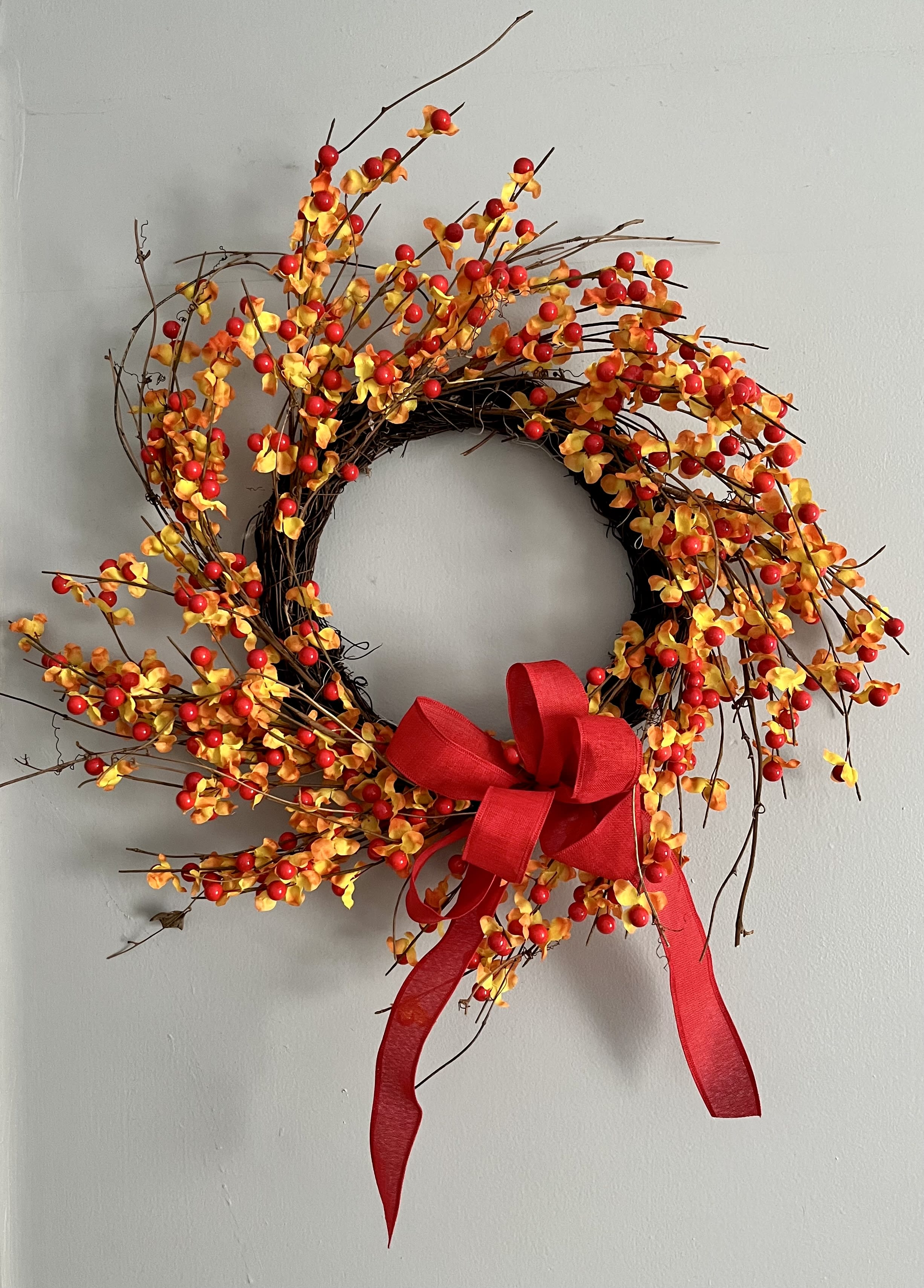 Autumn Berry Wreath  - An 18” diameter artificial berry wreath. Weather resistant for outdoor use or for indoor decor that will last all season. 