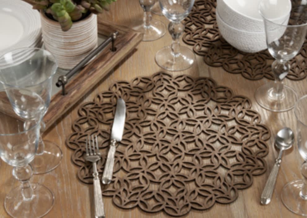 Set of 4 Laser Cut Placemats - Give your tabletop a modern transformation with this set of laser cut round placemats.   Discover the art of giving at Petals, Wilmington, Delaware’s destination for luxury gifts and home décor. Our curated collection features beautifully crafted items for every occasion — birthdays, weddings, anniversaries, holidays, and life’s special celebrations. At Petals, we believe every gift should tell a story. From hand-poured candles and elegant keepsakes to stylish home accents, gourmet treats, and floral-inspired décor, our selection combines timeless charm with modern sophistication. Each piece is chosen with care to reflect the quality, creativity, and personal touch our Wilmington customers love.  Same-day delivery available throughout Wilmington and nearby areas including Greenville, Hockessin, Newark, and the Brandywine Valley Whether you’re looking for a thoughtful hostess gift, a luxury home accent, or something simply beautiful to brighten someone’s day, Petals offers fine gifts and personalized service that make every occasion memorable.  Visit our Wilmington boutique or shop online today — and see why Petals is Delaware’s trusted name for fine gifts and inspired giving.