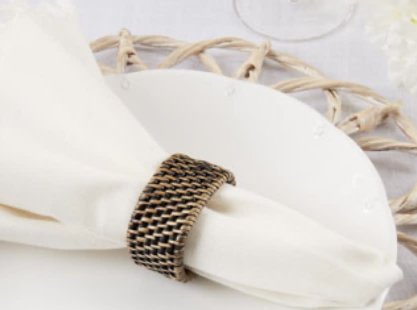 Set of 4 Brown Woven Rattan Napkin Rings - The perfect choice for casual entertaining and outdoor dinner parties.  Discover the art of giving at Petals, Wilmington, Delaware’s destination for luxury gifts and home décor. Our curated collection features beautifully crafted items for every occasion — birthdays, weddings, anniversaries, holidays, and life’s special celebrations. At Petals, we believe every gift should tell a story. From hand-poured candles and elegant keepsakes to stylish home accents, gourmet treats, and floral-inspired décor, our selection combines timeless charm with modern sophistication. Each piece is chosen with care to reflect the quality, creativity, and personal touch our Wilmington customers love.  Same-day delivery available throughout Wilmington and nearby areas including Greenville, Hockessin, Newark, and the Brandywine Valley Whether you’re looking for a thoughtful hostess gift, a luxury home accent, or something simply beautiful to brighten someone’s day, Petals offers fine gifts and personalized service that make every occasion memorable.  Visit our Wilmington boutique or shop online today — and see why Petals is Delaware’s trusted name for fine gifts and inspired giving.