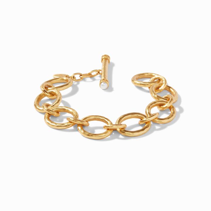 Catalina Demi Link Bracelet  - A luxurious Julie Voss bracelet of lightly hammered golden links, finished with a toggle closure. 24K gold plate Regular measures 8-inch length  Discover the art of giving at Petals, Wilmington, Delaware’s destination for luxury gifts and home décor. Our curated collection features beautifully crafted items for every occasion — birthdays, weddings, anniversaries, holidays, and life’s special celebrations. At Petals, we believe every gift should tell a story. From hand-poured candles and elegant keepsakes to stylish home accents, gourmet treats, and floral-inspired décor, our selection combines timeless charm with modern sophistication. Each piece is chosen with care to reflect the quality, creativity, and personal touch our Wilmington customers love.  Same-day delivery available throughout Wilmington and nearby areas including Greenville, Hockessin, Newark, and the Brandywine Valley Whether you’re looking for a thoughtful hostess gift, a luxury home accent, or something simply beautiful to brighten someone’s day, Petals offers fine gifts and personalized service that make every occasion memorable.  Visit our Wilmington boutique or shop online today — and see why Petals is Delaware’s trusted name for fine gifts and inspired giving.  