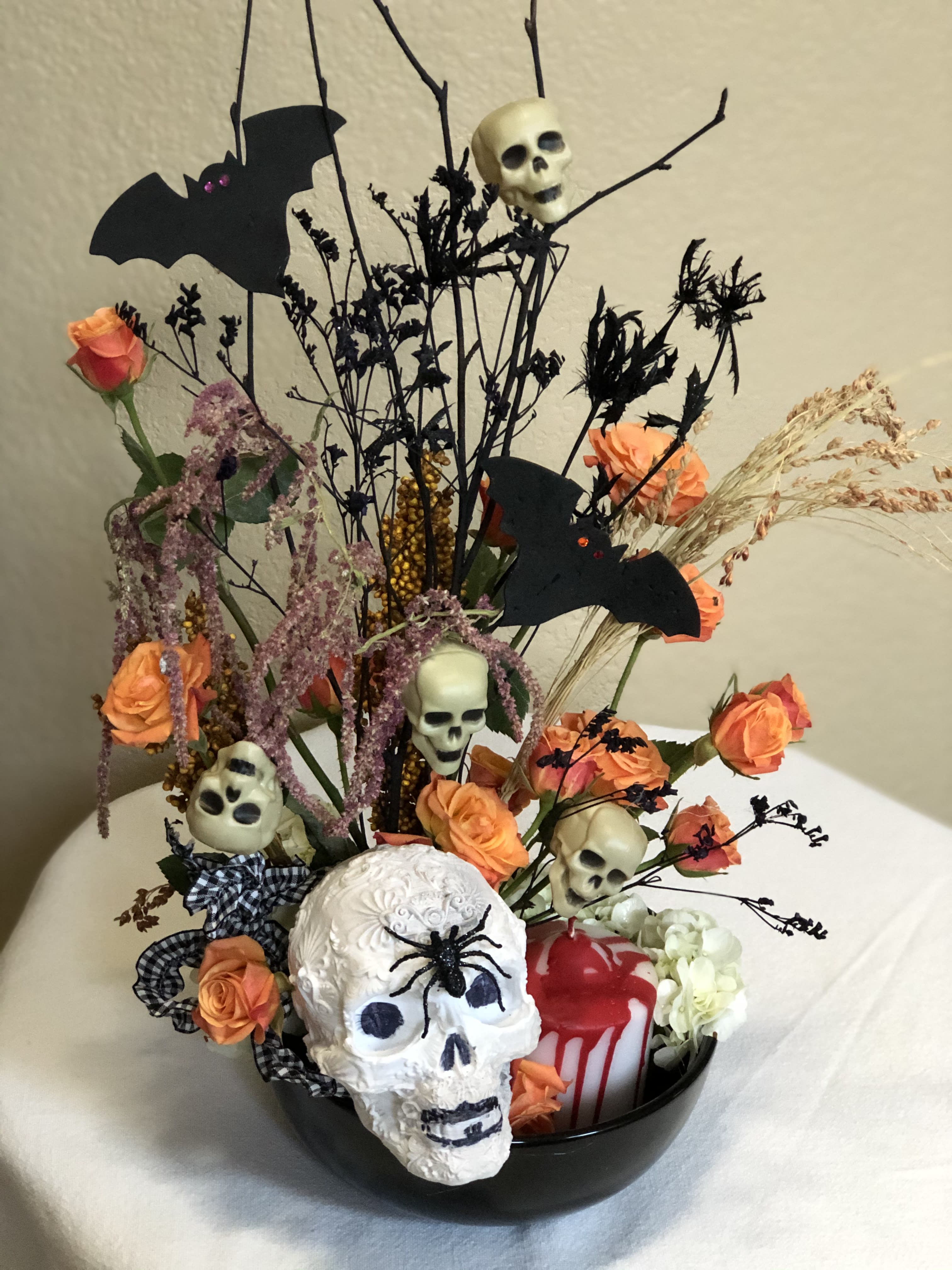 Very scary! - All the scary bits plus white hydrangea and orange spray roses to make a spooky impression!