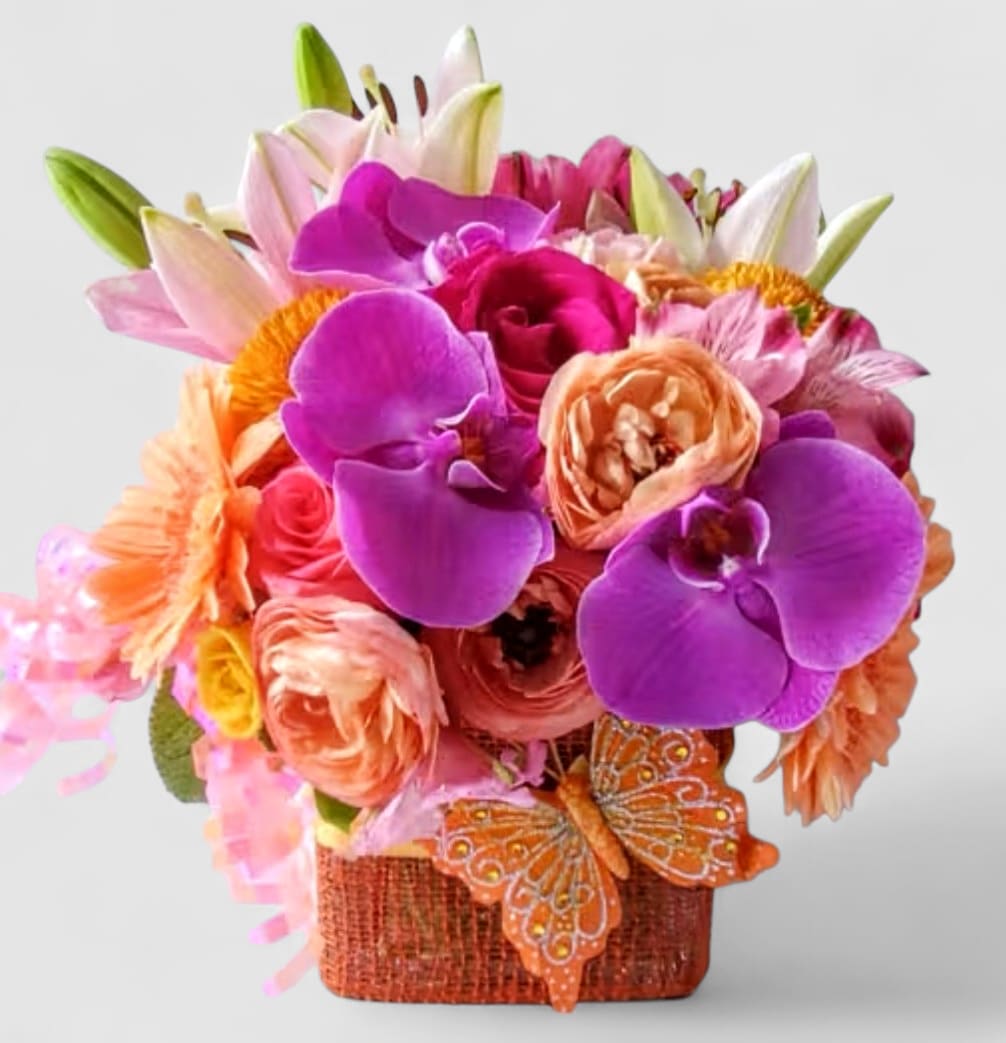 Violet Blush Beauty Bouquet Designer's Choice - Send this beauty today with it's violet and blush colored blossoms of that day roses orchids and more arranged in a modern glass vase wrapped in blush jute ribbon. Perfect to send for every occasion to show them how much you care. All bouquets are always made extra special and unique each time. Please visit my beautiful gallery to see my most recent designs that I have created for my online customers. Send them happiness today.