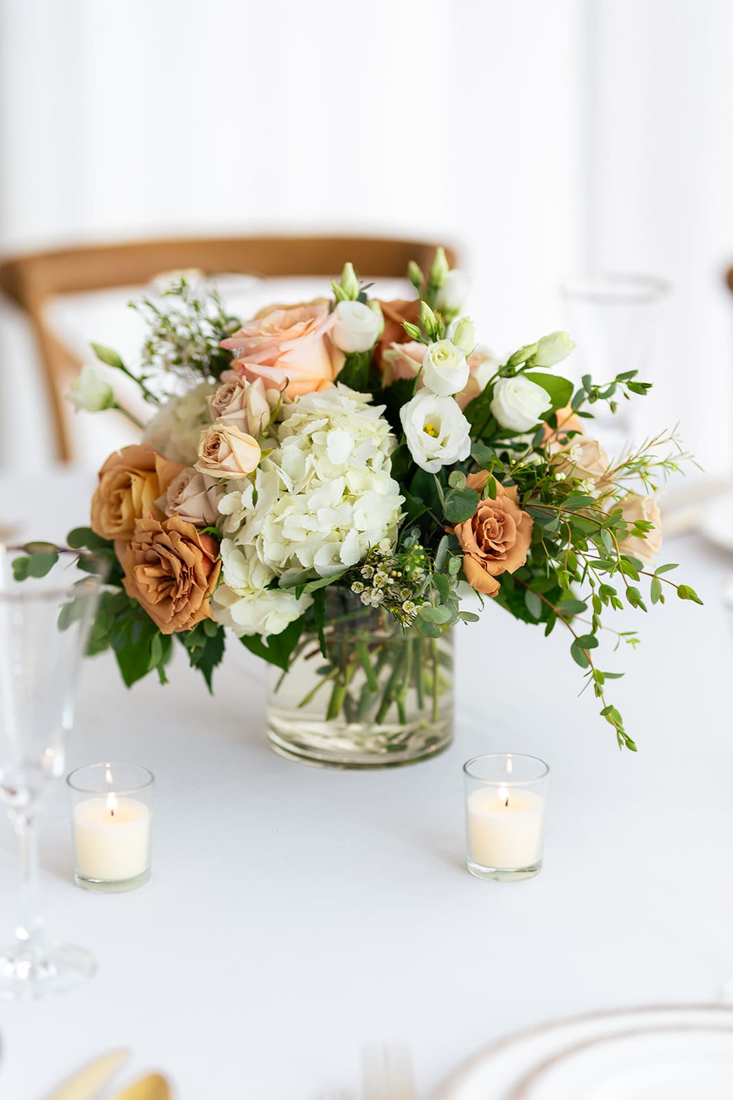 Autumn Spice - Market Size   Autumn Spice - Market Size   - Earthy shades of champagne, rust, ivory and soft peach are artfully combined to create a soft and romantic fall color story. Flowers include hydrangea, roses, Lisianthis, Waxflower and Eucalyptus. Perfect for an event, a gift or your home. Arrangement is approximately 10" high and 10" wide.