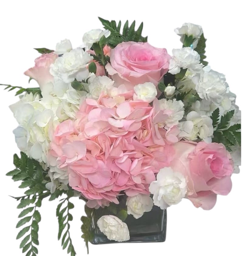 Pink Harmony Bouquet - A tender blend of blush pink hydrangeas, soft pink roses, and pure white carnations artfully arranged in a glass cube vase. This bouquet captures the beauty of love and grace, perfect for birthdays, anniversaries, weddings, or simply to brighten someone’s day.