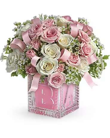 Baby's First Block by Teleflora - Pink  - Celebrate the cutest baby girl on the block's arrival with this charming glass baby block that arrives chock full of pretty flowers. Perfect for baby showers, too! The glass block will make an adorable display piece for years!