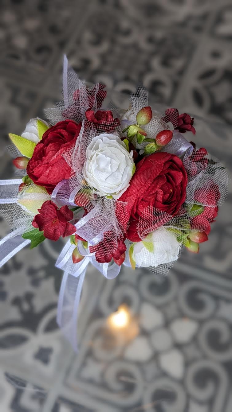 Dancing Queen Silk Wrist Corsage - These are artificial flowers. The flowers and ribbon cannot be changed. It is currently on a white snap band but can be put on a black, silver or gold snap band if needed, if they are available.