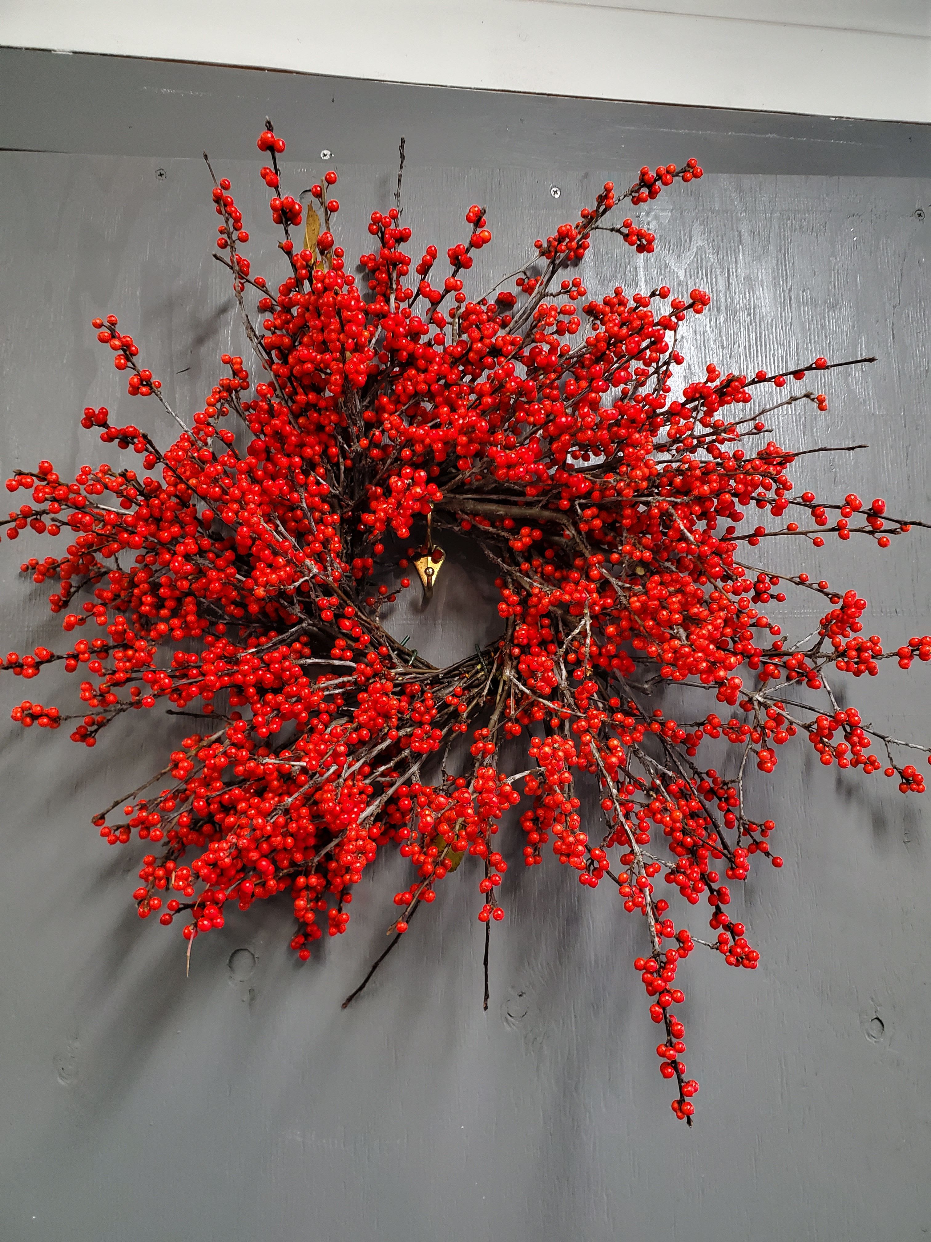 Holiday Berry Wreath - A fresh mix of stems chosen for their color and character—ready to be shaped into a personal masterpiece.  Important Note: We are a custom design studio florist in a small town. Every bouquet we create is a one-of-a-kind creation, tailored to the season, availability of flowers, color choice, artistic interpretation, and the current materials available. The photos do not represent the exact flowers that will be delivered. They are intended to provide you with an idea of what we do, how we do it, and the variance that can be expected. 