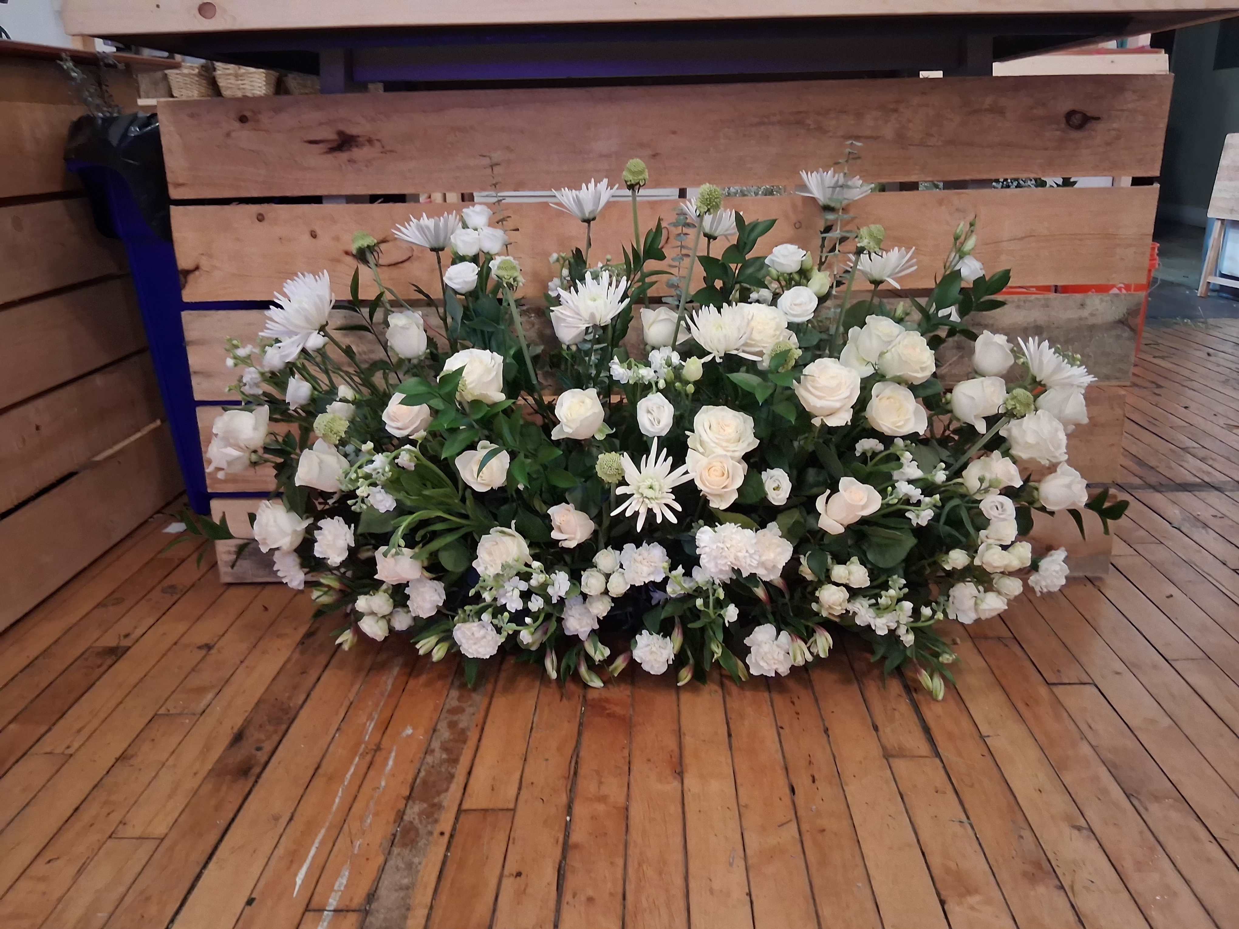 Melissa's wedding king table under the table centerpiece - Beautiful garden style under table sweetheart table centerpiece of white roses, carnations, stuck, scabiosa and other fillers.