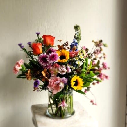 Seasonal Blooms - Designer's Choice - Let us create something just for you with the best of what’s blooming now. Each arrangement is one-of-a-kind, designed from fresh, seasonal flowers. No two are alike—just beautiful, surprise-filled blooms crafted with a designer’s touch.  Important Note: Every bouquet we create is a one-of-a-kind creation, tailored to the season, availability of flowers, color choice, artistic interpretation, and the current materials available. The photos do not represent the exact flowers that will be delivered. They are intended to provide you with an idea of what we do, how we do it, and the variance that can be expected.  