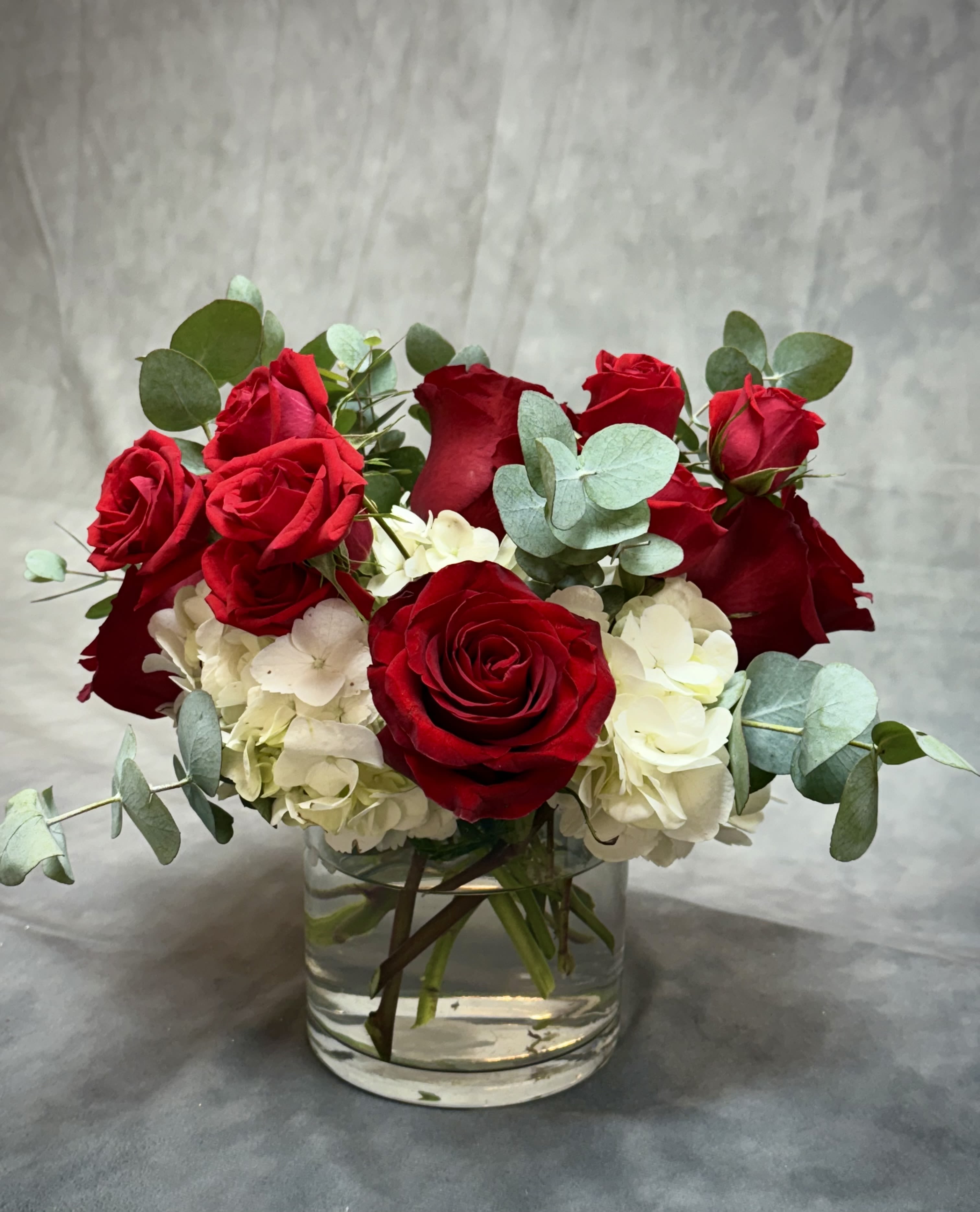 Red blooms  - Celebrate the season with the timeless beauty of red blooms florals! J&amp;S Floral introduces our newest Christmas-inspired designs, perfect for adding warmth and joy to your holiday celebrations. A beautiful arrangement combines the beauty of red roses with the soft of white hydrangeas and greenery. Each design is handcrafted with care to bring holiday cheer to your home or to gift someone special. Order now to make your Christmas unforgettable!
