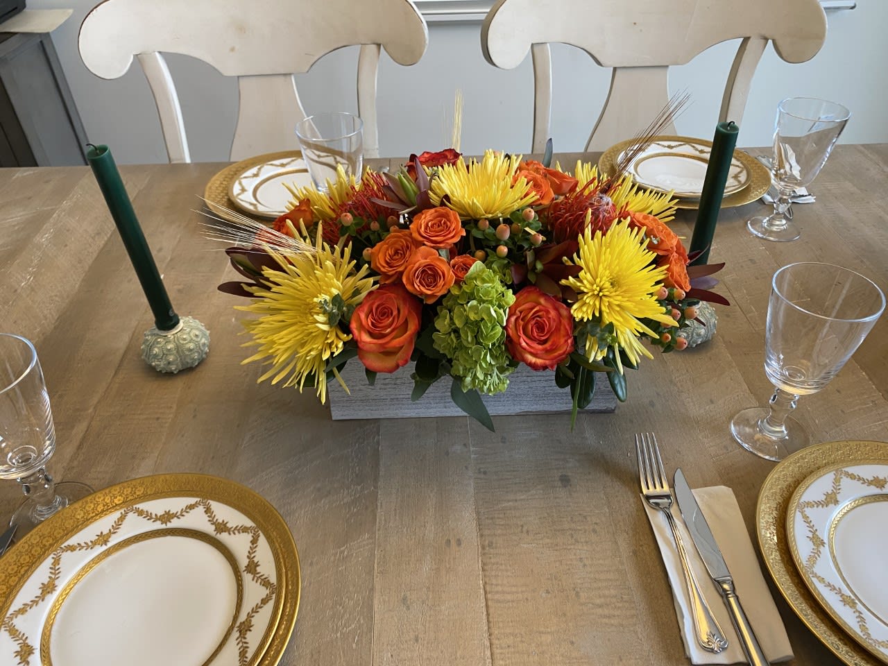 Family Thanksgiving - Beautiful table centerpiece, arranged in a  10 inch long rectangular  lined container - Filled with all the colors of Fall - Red / Orange Roses / Yellow Spiders / Mini green Hydrangea / Protea and Hypericum Berries - Perfect for a table of 4-6 people. - Please see up close photo also- ONLY FOR THANKSGIVING