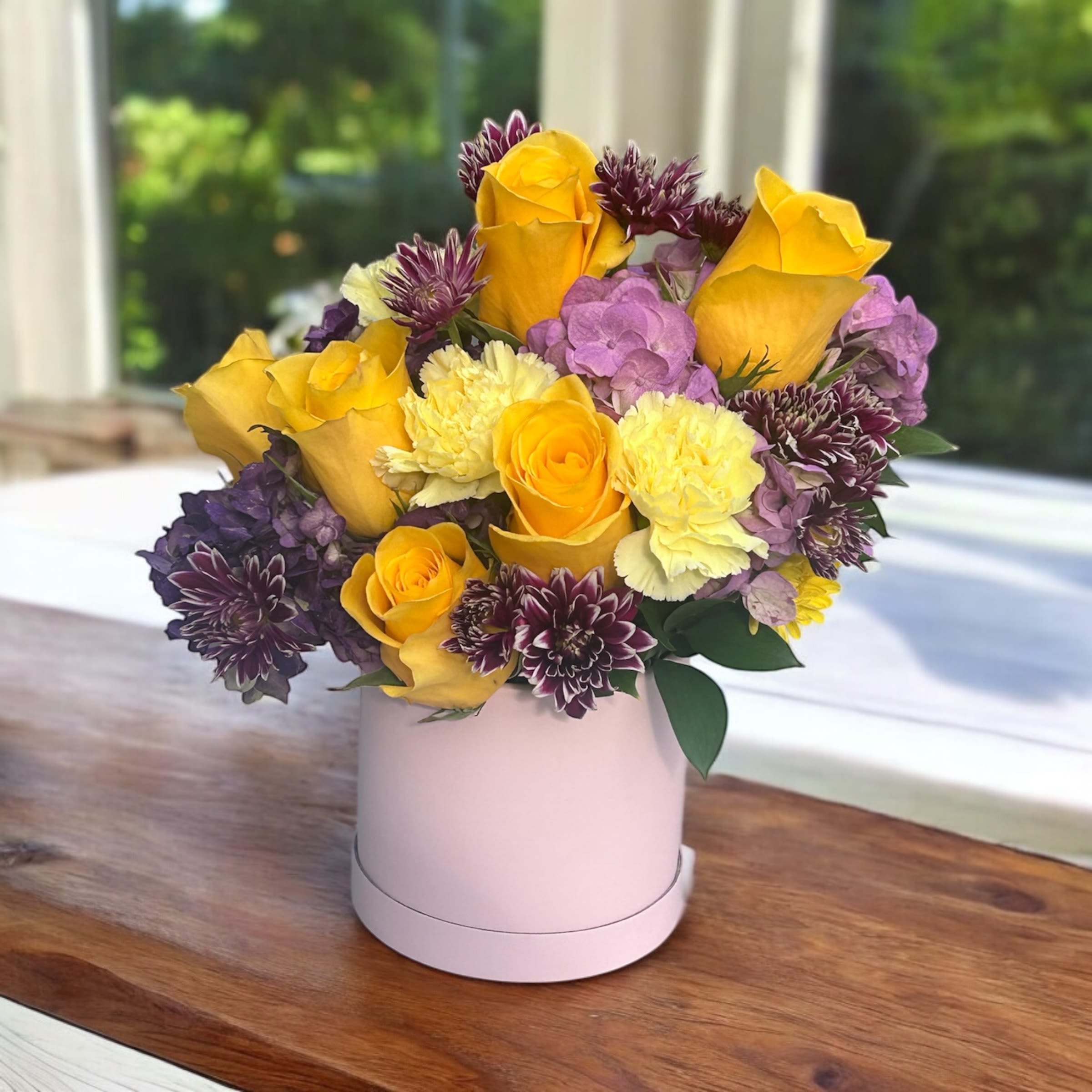 Forever Her Blooms - Lavender Blooms is a graceful and soothing floral arrangement that captures the essence of calm and elegance. Featuring soft lavender roses as the focal point, this bouquet is complemented by lush green foliage and delicate white alstroemerias, creating a serene blend of color and texture. Perfect for expressing tranquility, affection, or sympathy, this arrangement brings a gentle beauty to any space.