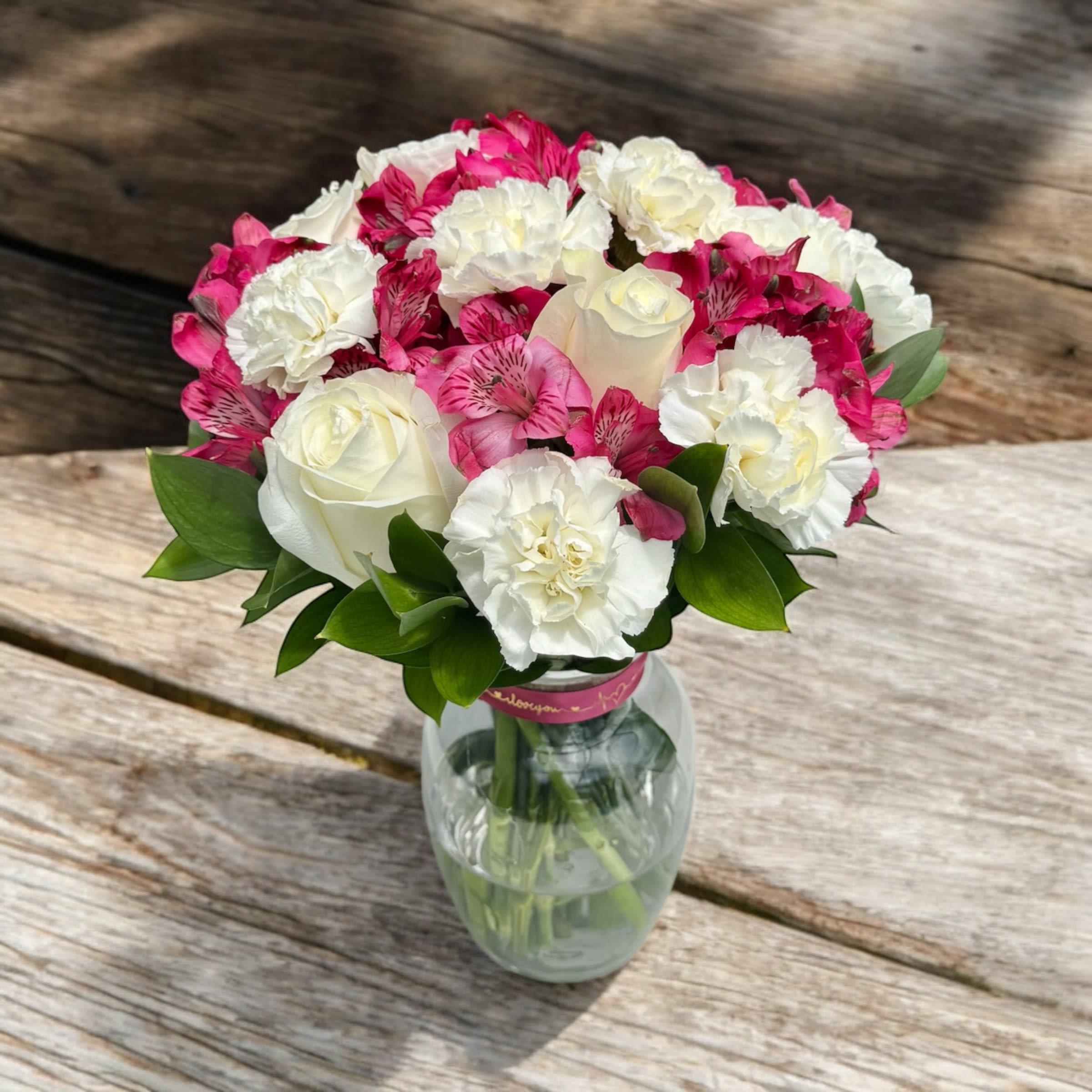 Purple Star MDay - A delicate arrangement featuring serene lavender and pristine white blooms, intertwining to create an elegant display. The subtle fragrance of lavender complements the purity of the whites, evoking a sense of tranquility and refined beauty in this charming floral composition.