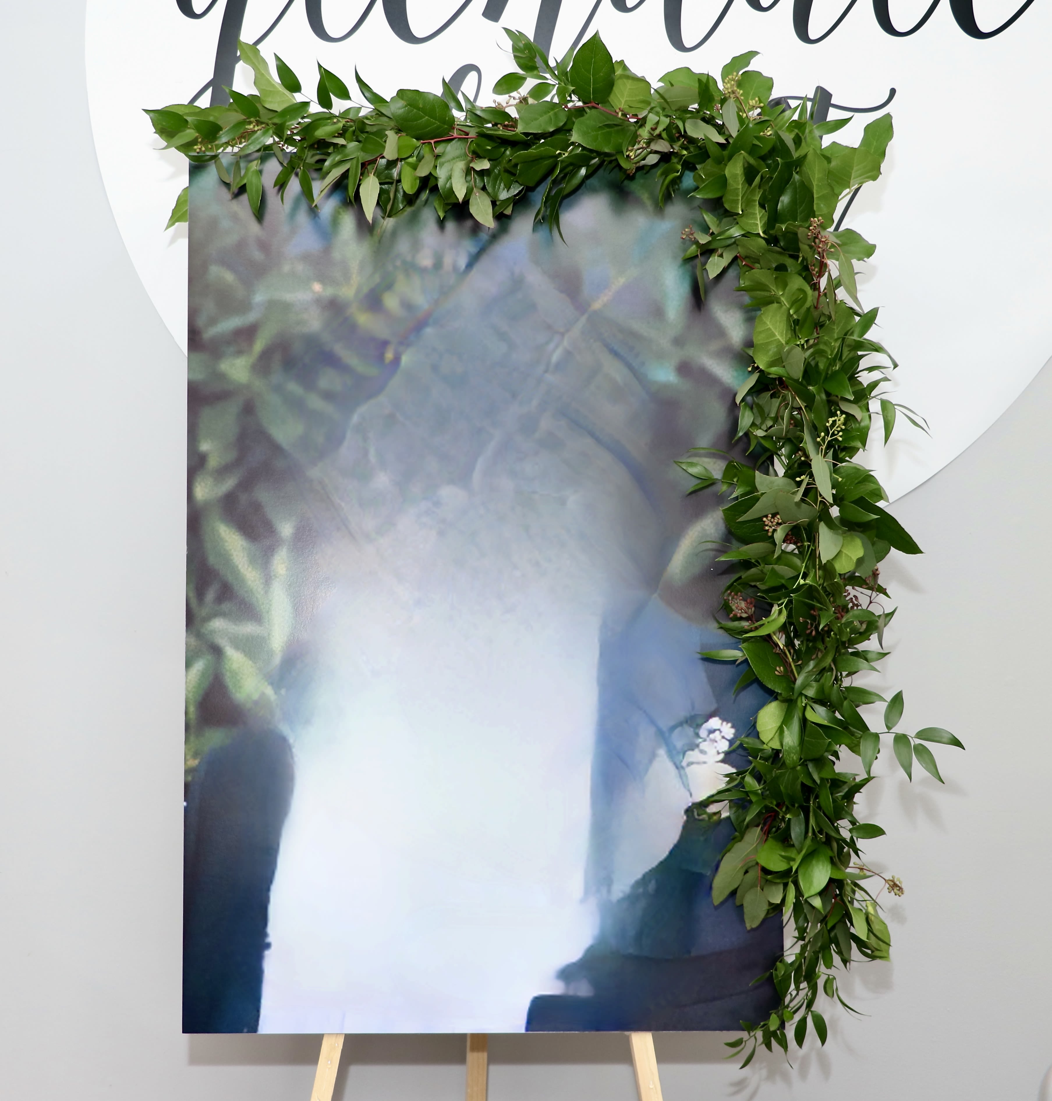 Frame Garland - We provide the garland, you provide the poster board of your loved one. If you need help printing it out give us a call to coordinate (at least 7 days prior). Smallest size should be 16x20; 20x24 would be deluxe; and 24x28 would be premium. 